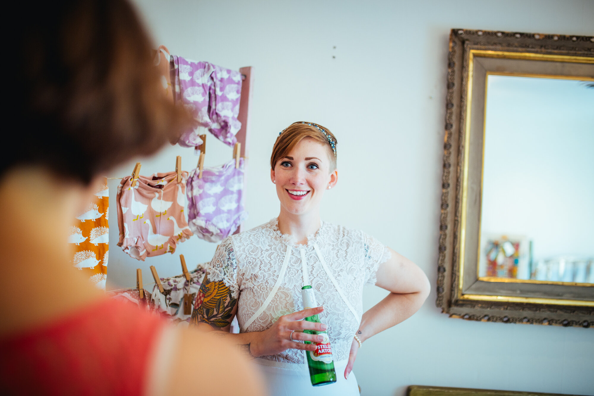 Future spouse drinking a beer in RVA home Shawnee Custalow queer wedding photographer