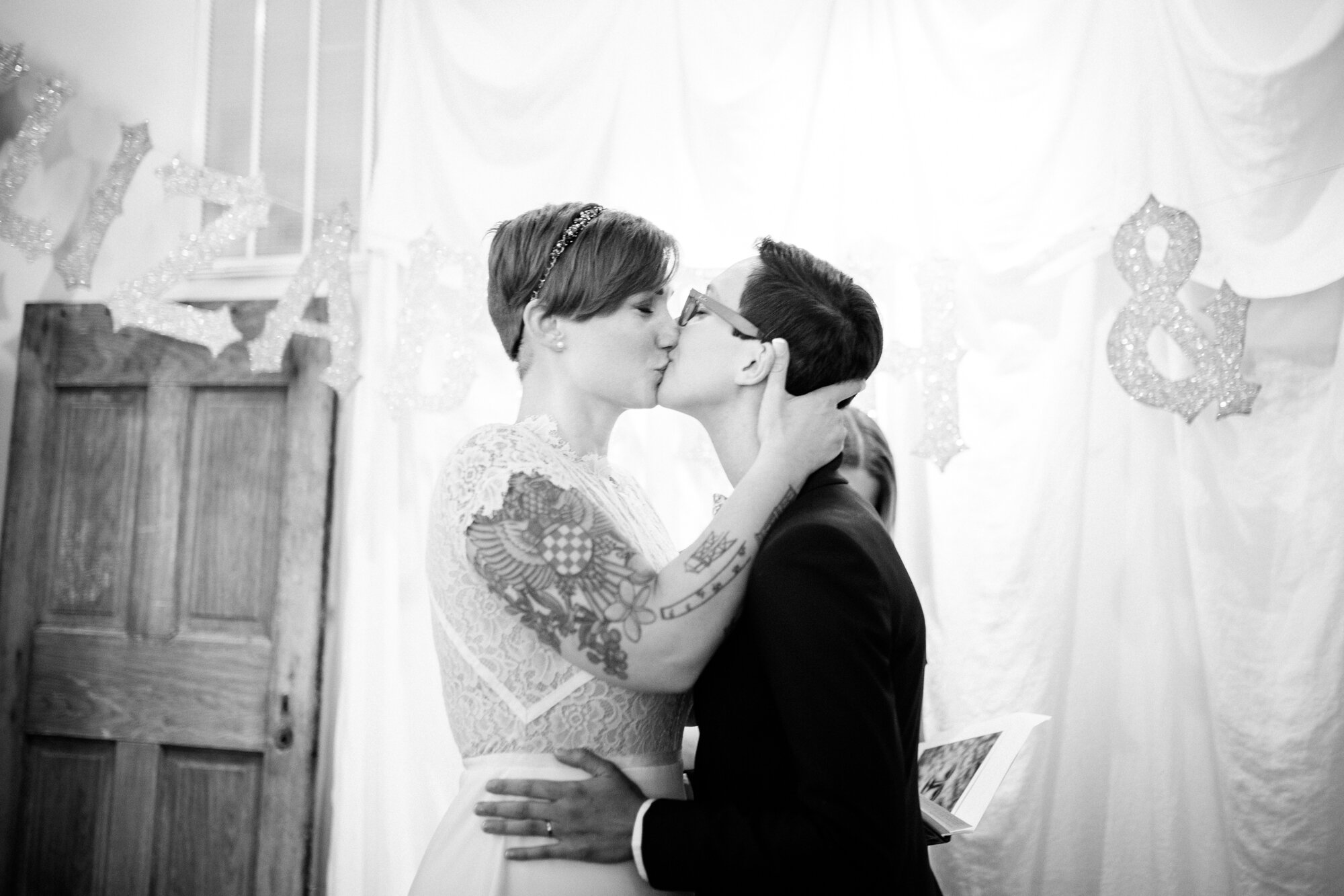 Queer newlyweds kissing in Gather at the Hallsboro Store VA Shawnee Custalow photography