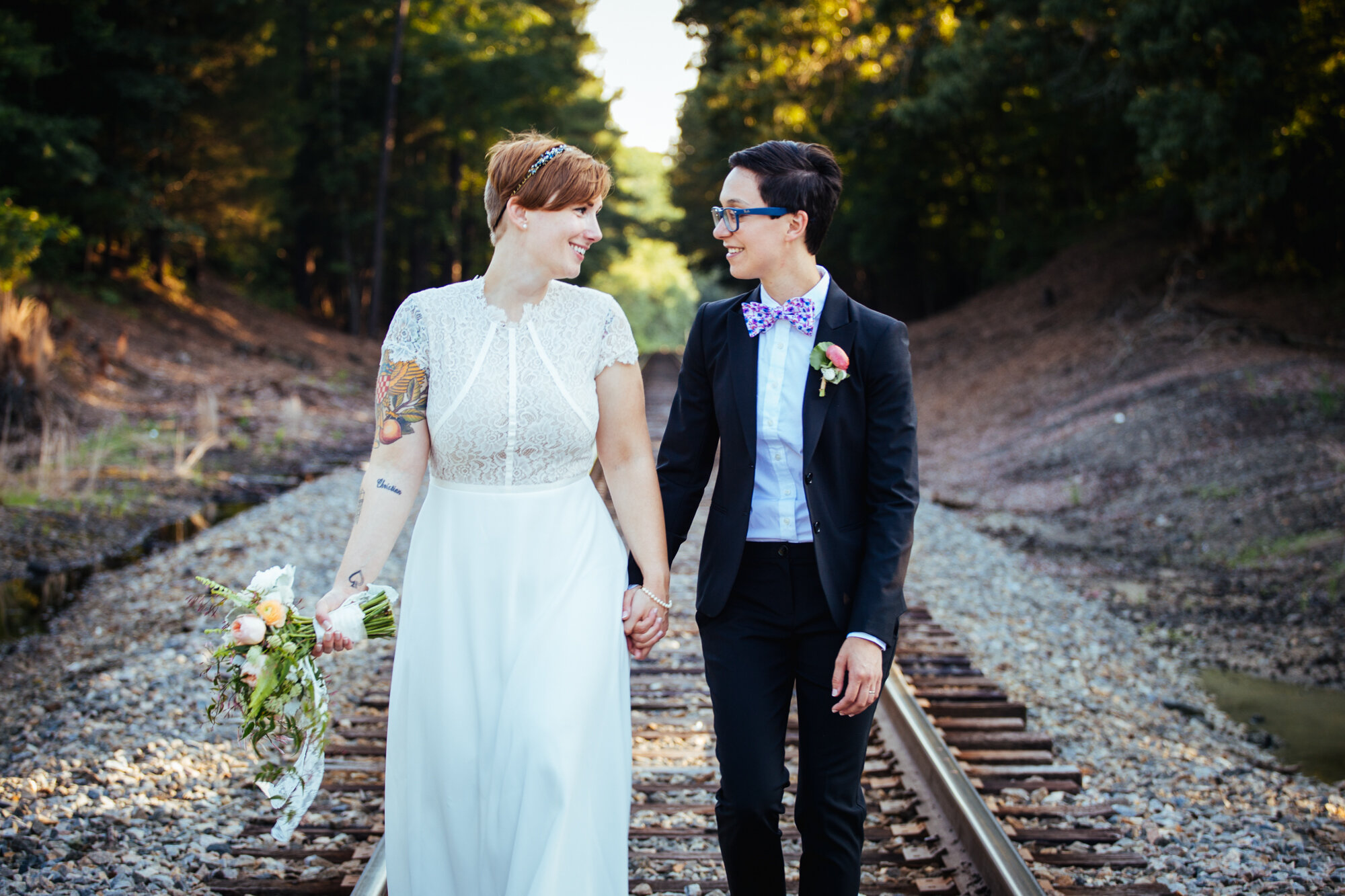 LGBTQ newlyweds walking hand in hand in Richmond VA Shawnee Custalow wedding photography