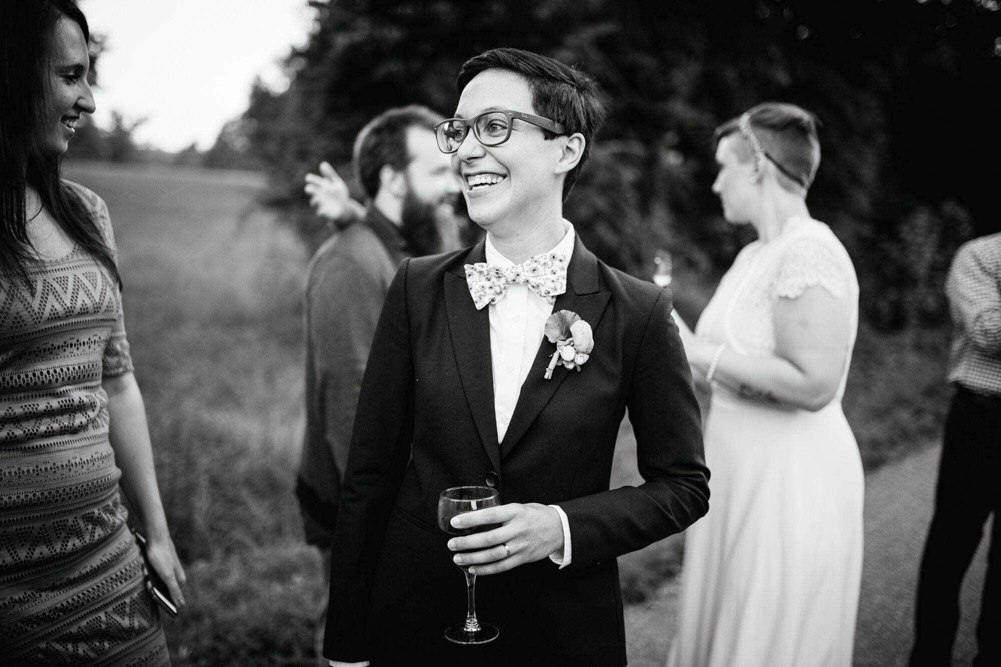 Happy newlywed with guests in Richmond VA Shawnee Custalow queer wedding photographer