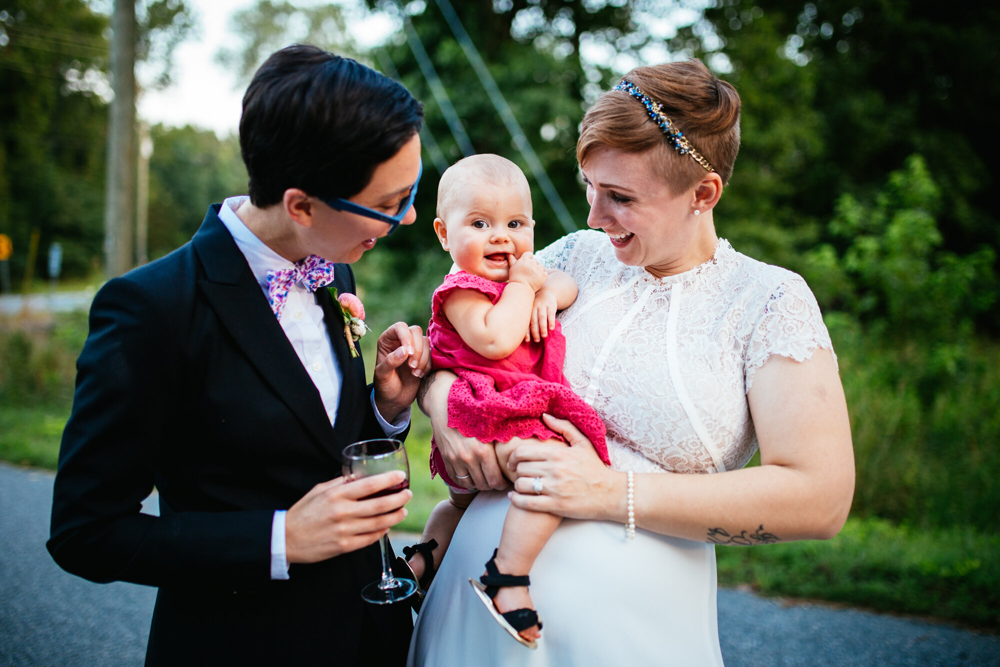 Newlyweds with infant in Richmond VA Shawnee Custalow queer wedding photographer