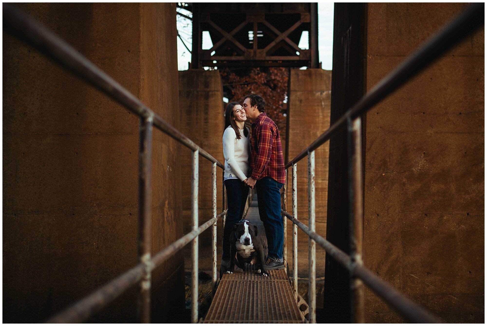 Engaged couple with pet dog on a bridge in Richmond VA Shawnee Custalow photography