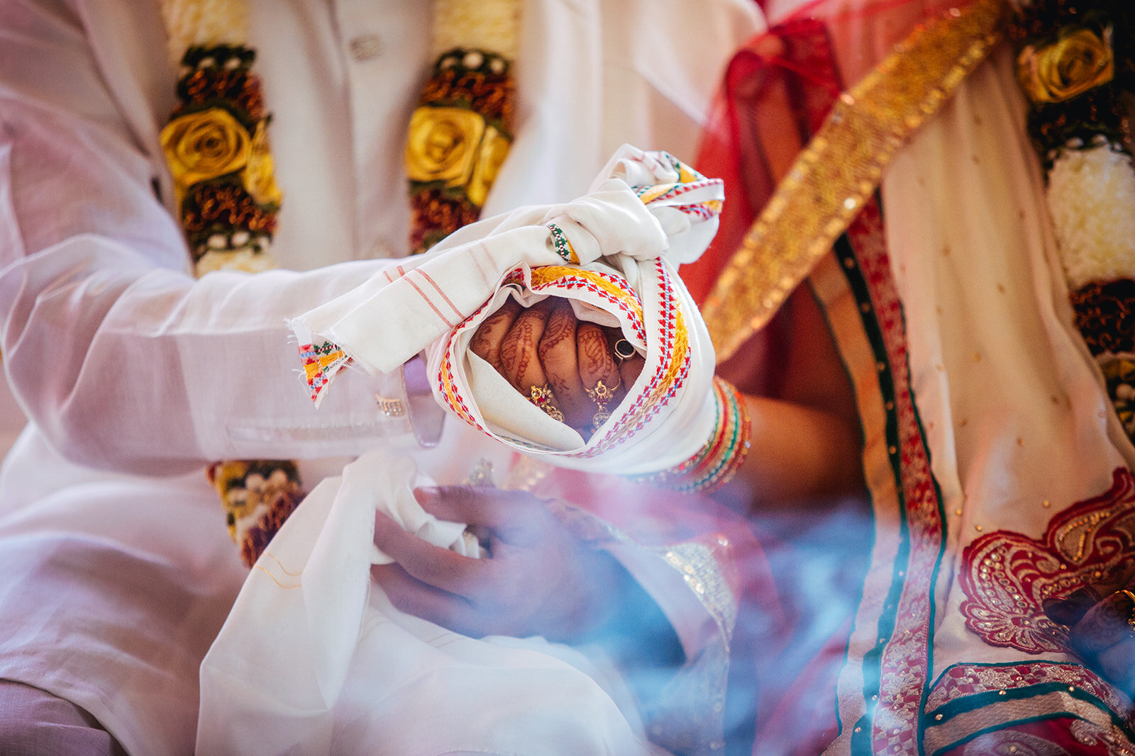 Bride and groom's hands wrapped in cloth in Richmond VA Shawnee Custalow photography