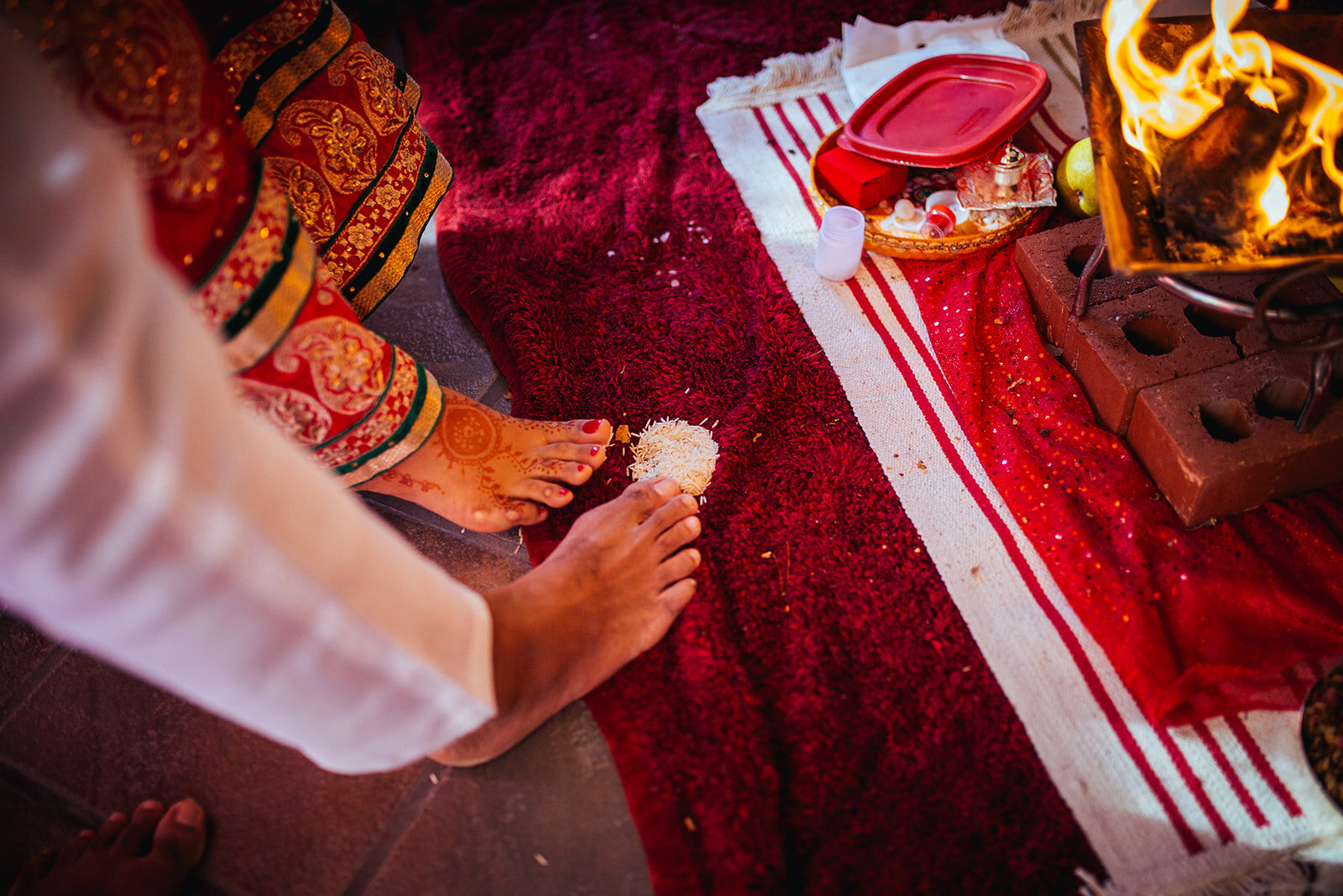 Bride and grooms feet with rice in Richmond VA Shawnee Custalow wedding photography