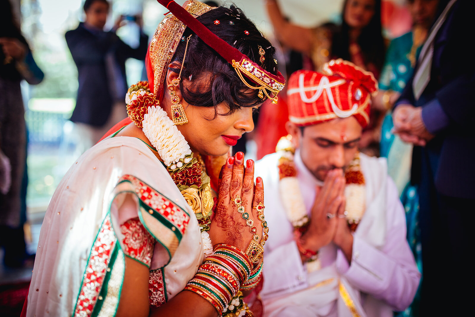 Indian Bride and groom praying in Richmond VA Shawnee Custalow wedding photography