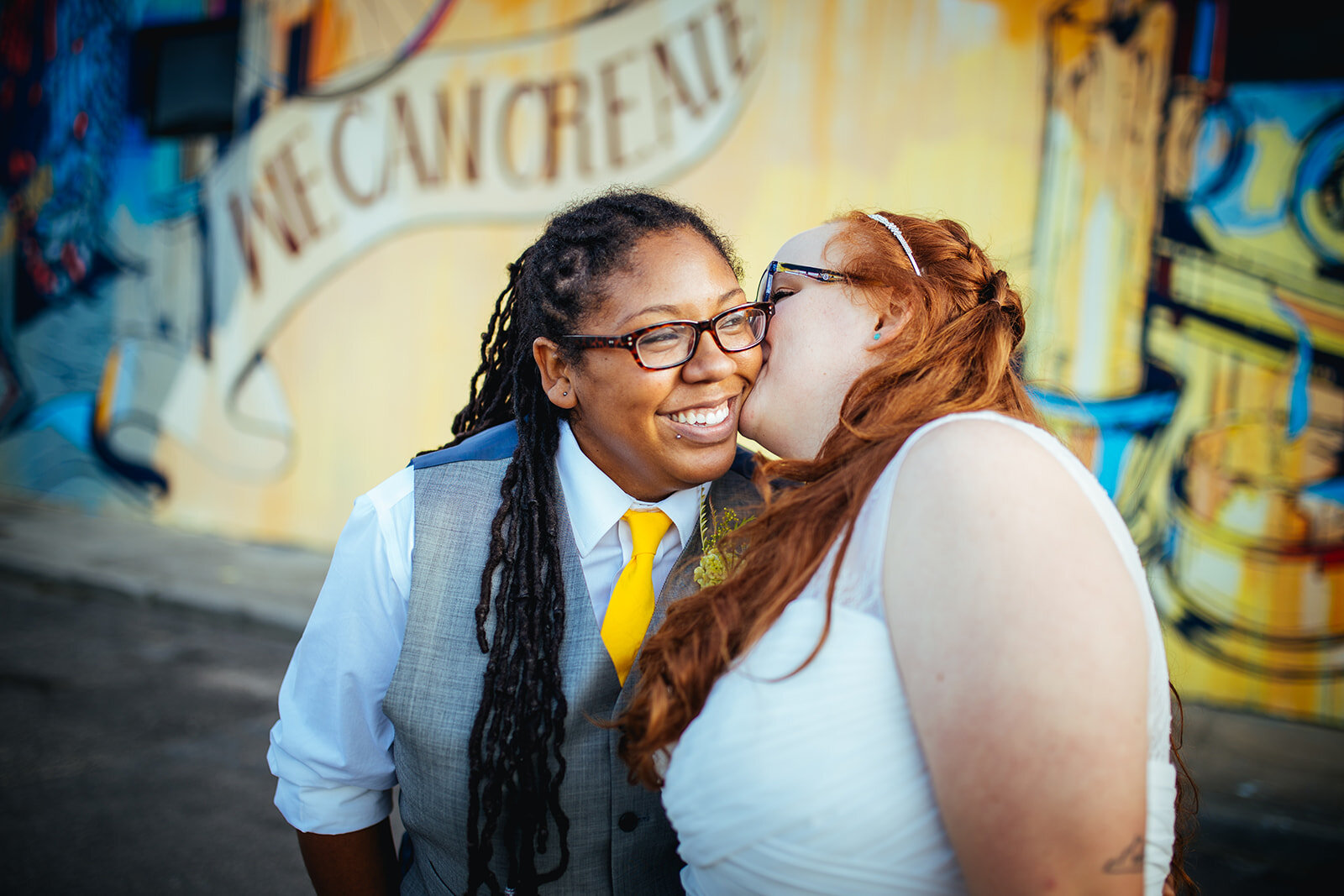 Newlywed kissing their spouses cheek in Norfolk VA Shawnee Custalow wedding photography