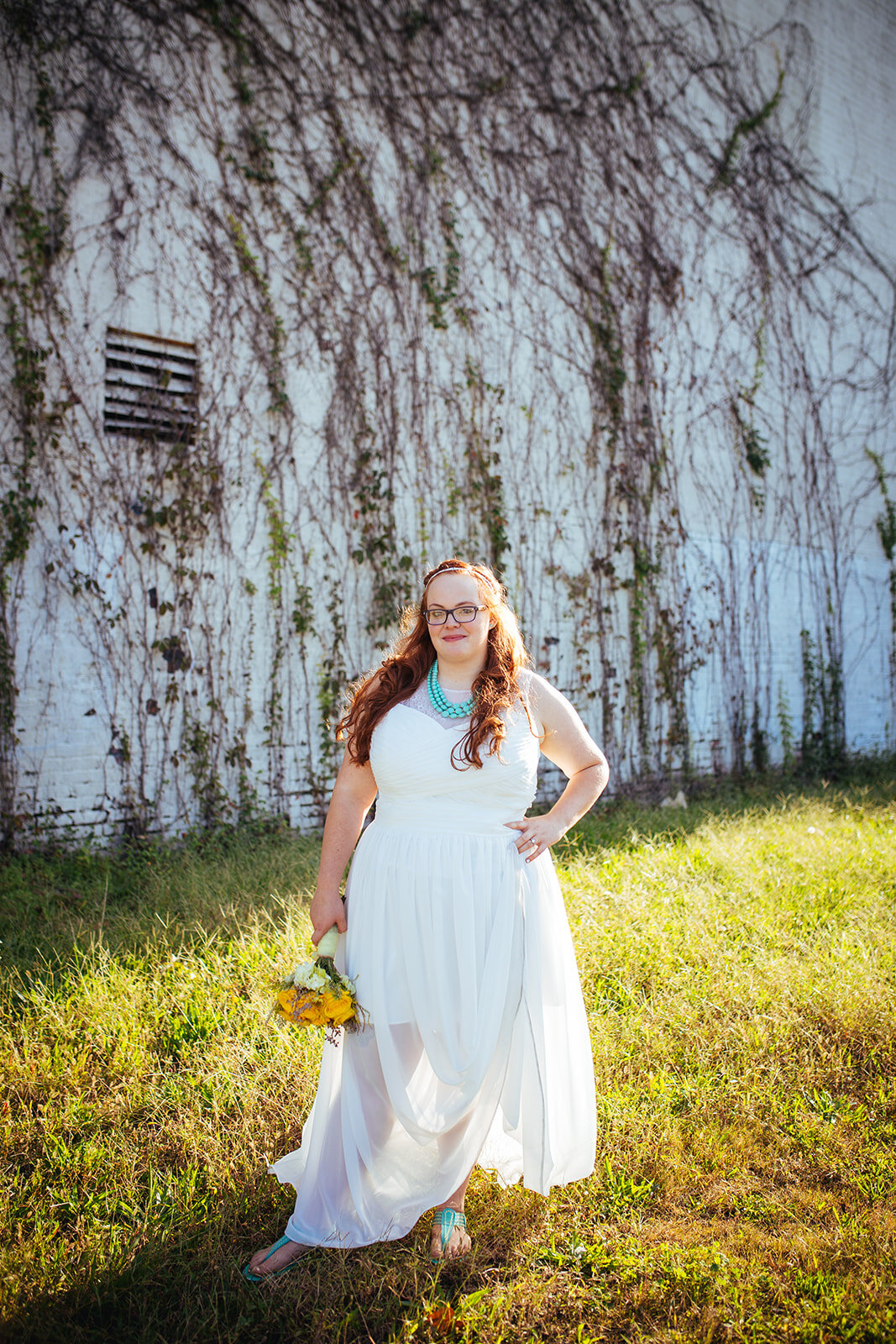 Newlywed in white dress with yellow bouquet in Norfolk VA Shawnee Custalow photography