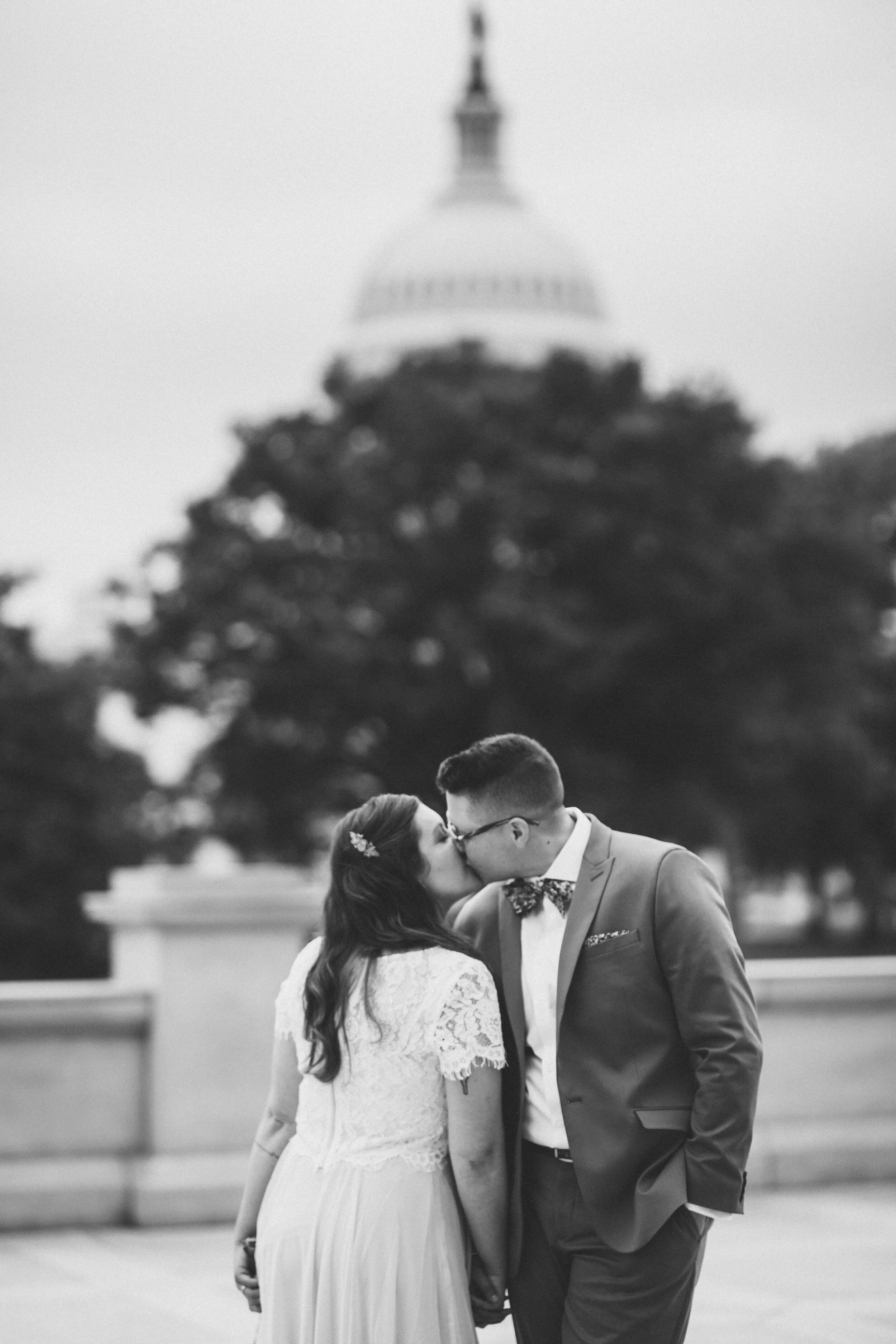 LGBTQ couple kissing in front of the Capitol building in washington DC Shawnee Custalow Queer Wedding photographer