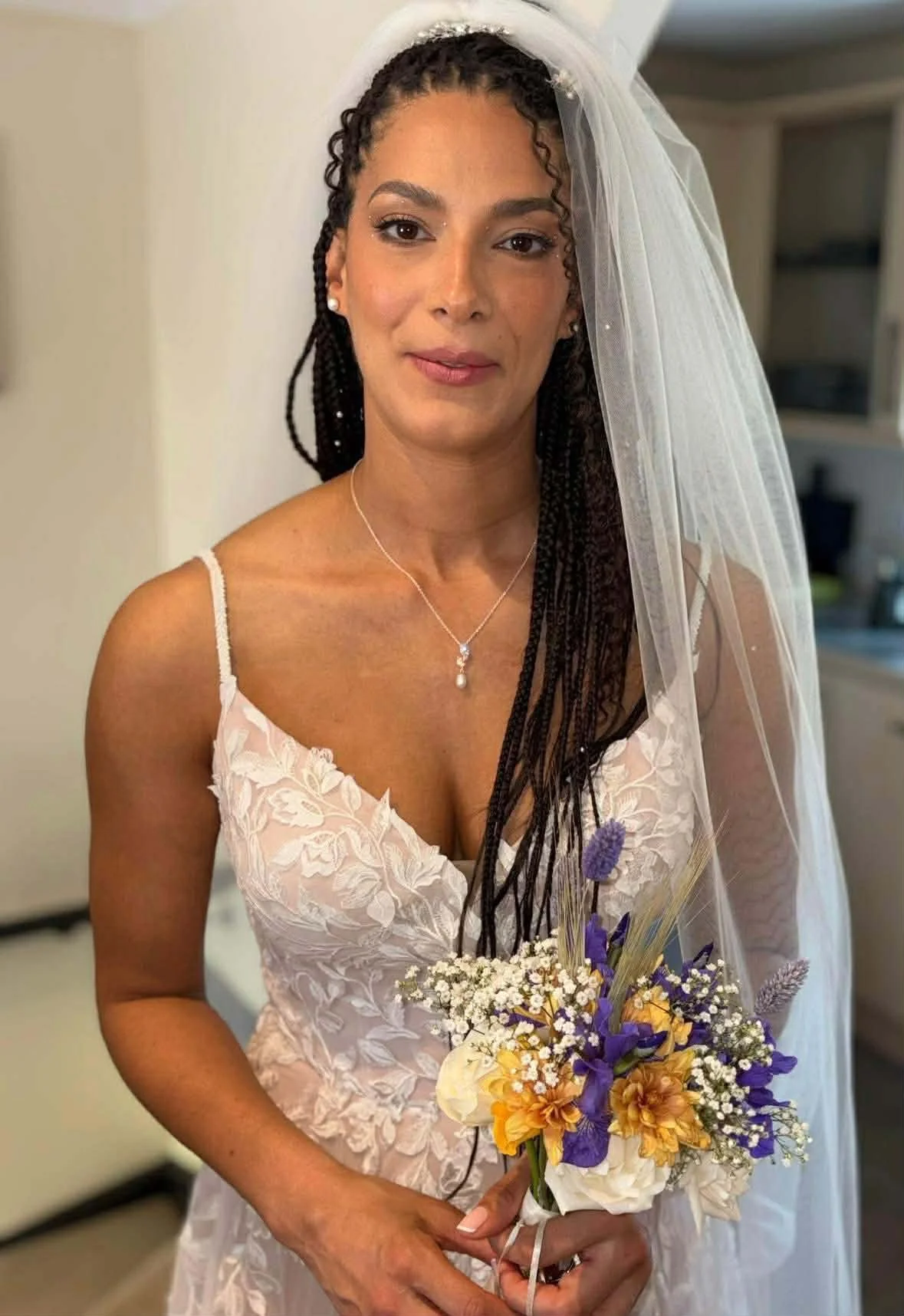 Soft glam bridal makeup on bride with veil by South Wales makeup artist Lowri Makeup Artist 