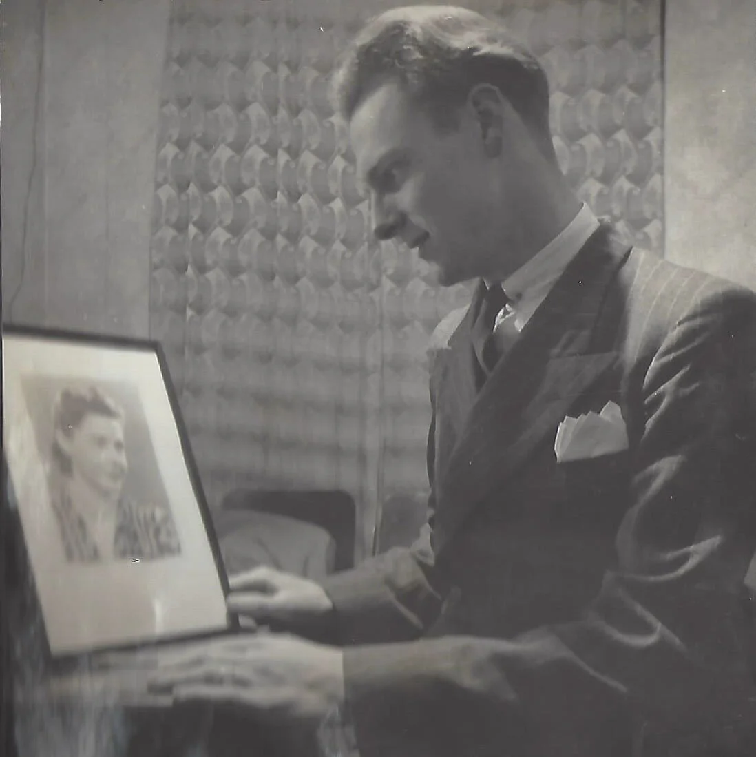 Mac looking at a photo of the author’s Gran.