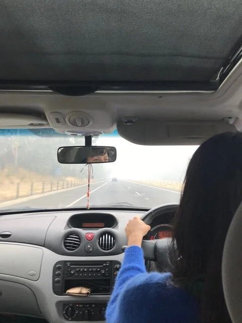 Michalia driving her kids towards Melbourne and out of the bush. THIS IS FINE.