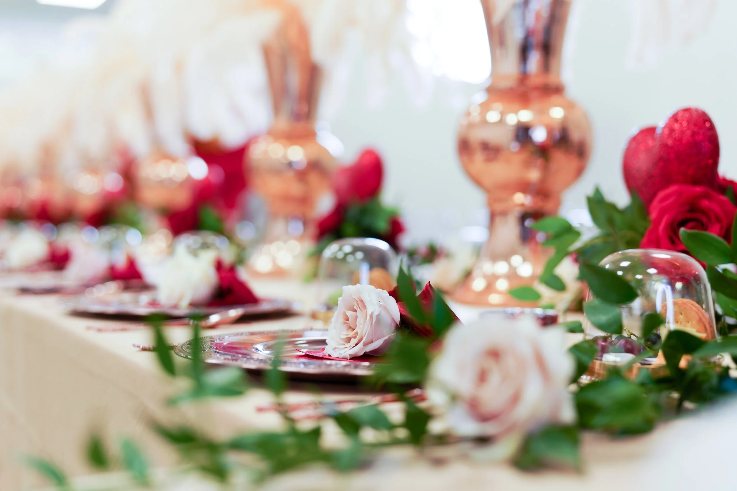 Valentine, Galentine, rose gold vases, ostrich feather centerpieces, red hearts, red roses