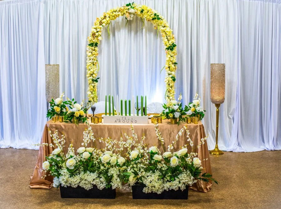 sweetheart table, candles, gold sequin tablecloth, crystal and gold floor vases