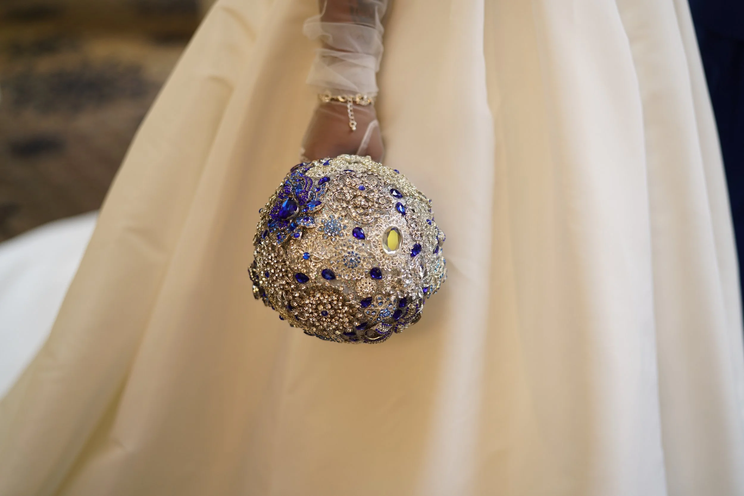 brooch bridal bouquet, white wedding gown