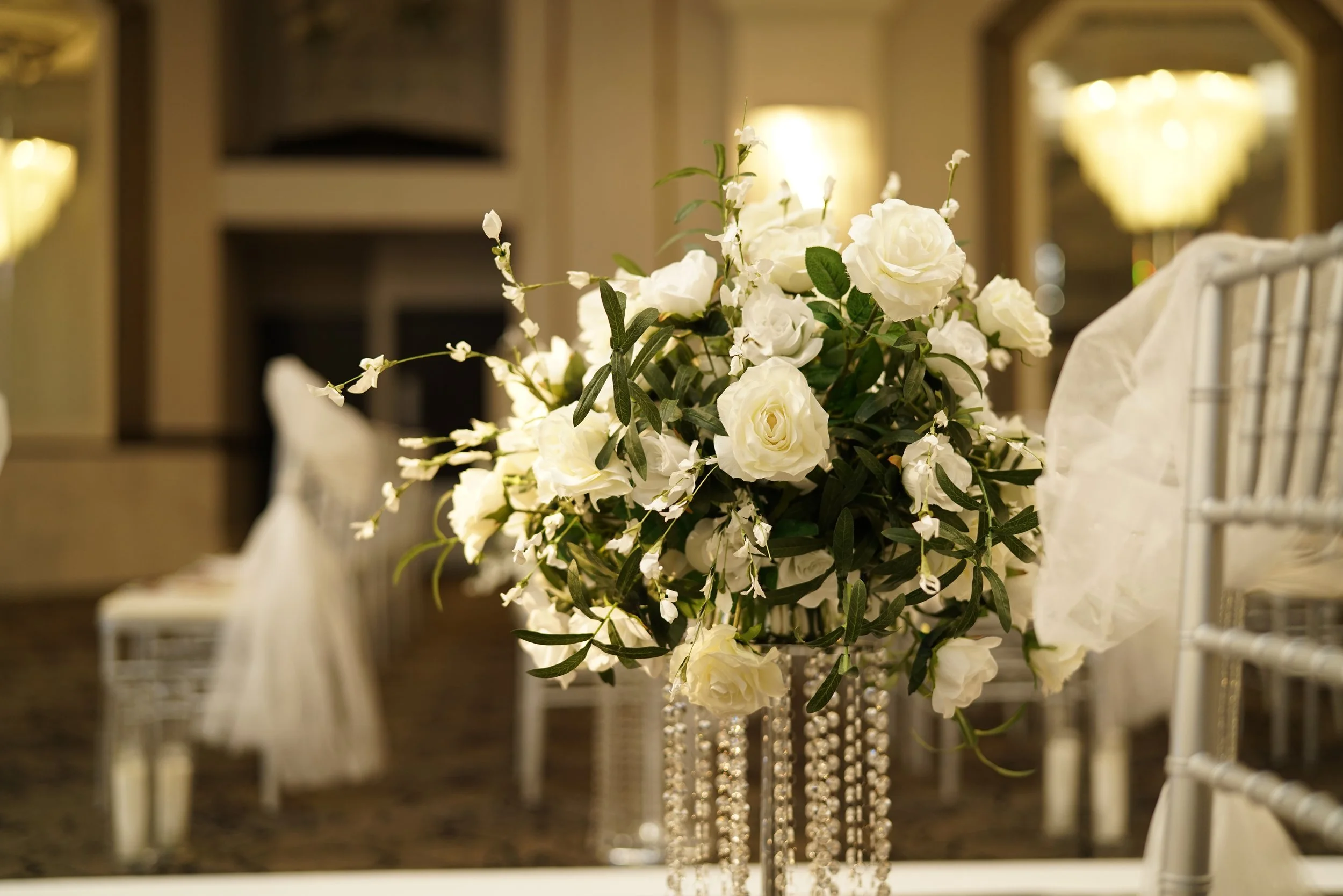 crystal floral stands, white roses, greenery