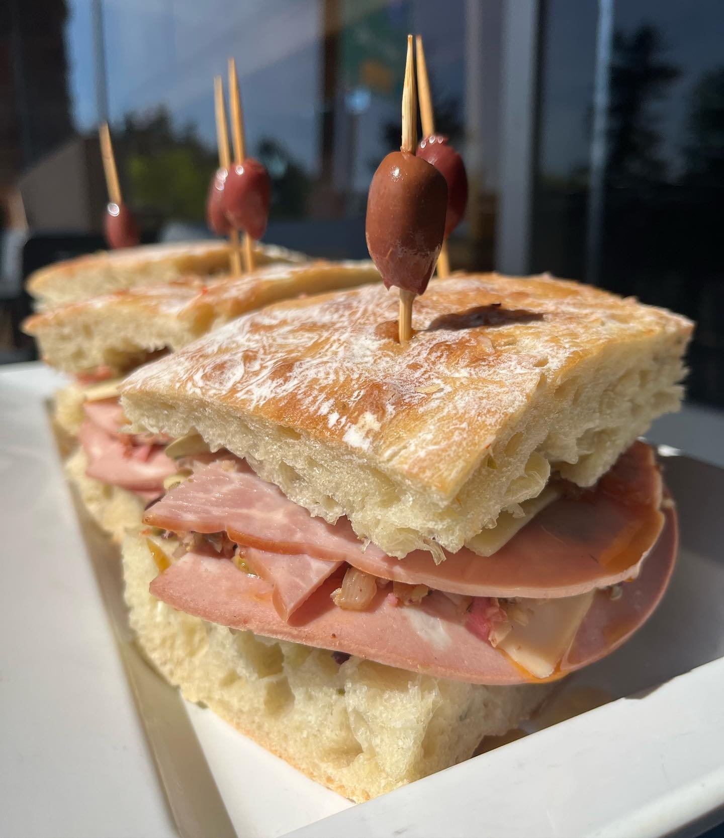 Give it up for our SW Barbur location&rsquo;s new specialty sandwich: the Muffuletta! 😋 That&rsquo;s right, we brought the Sicilian New Orleans favorite right here to SW Portland. We took 3 kinds of meat- mortadella, Genoa salami and ham, topped the