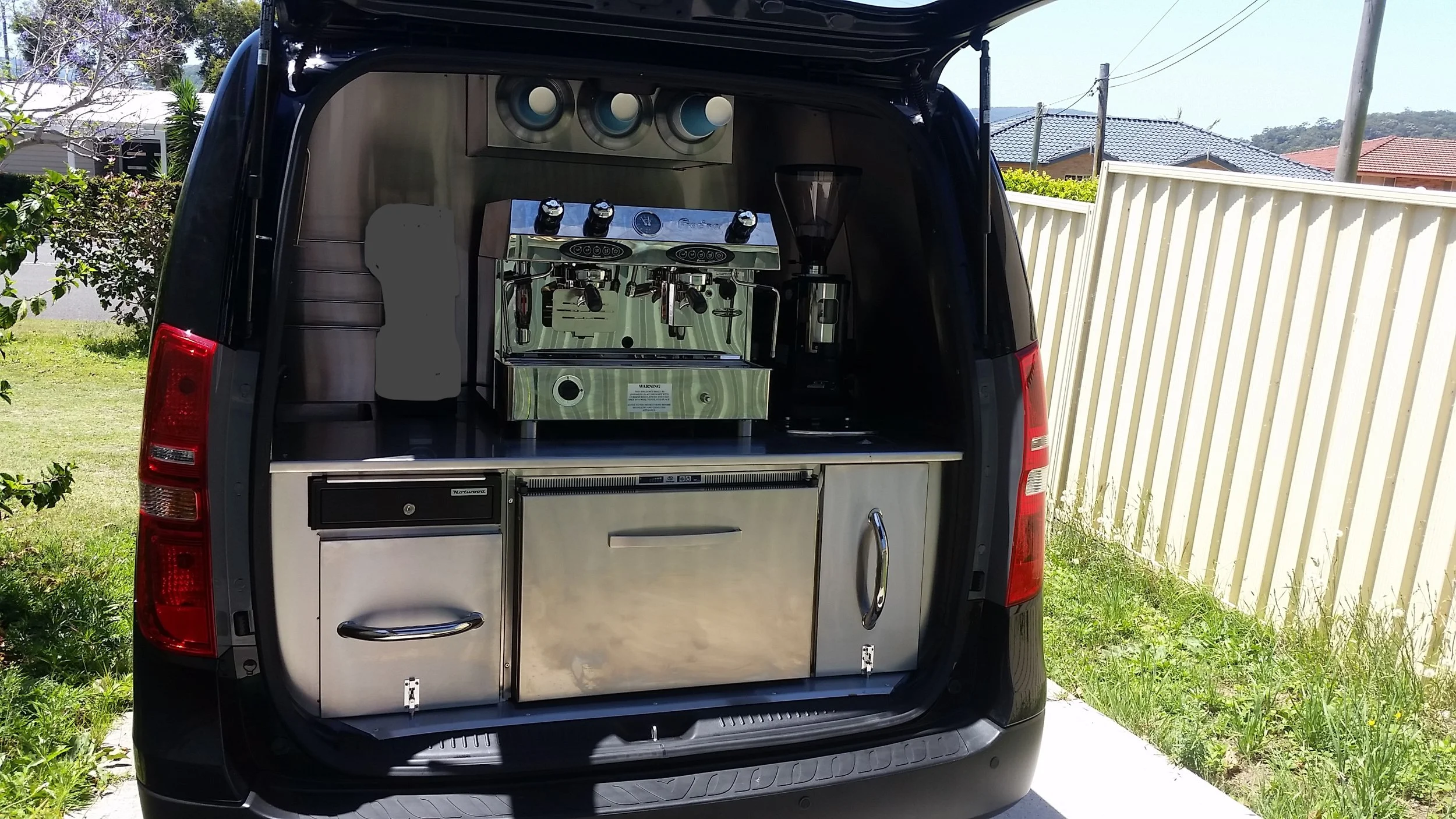 Joseph Suguturaga-Open back of van.jpg