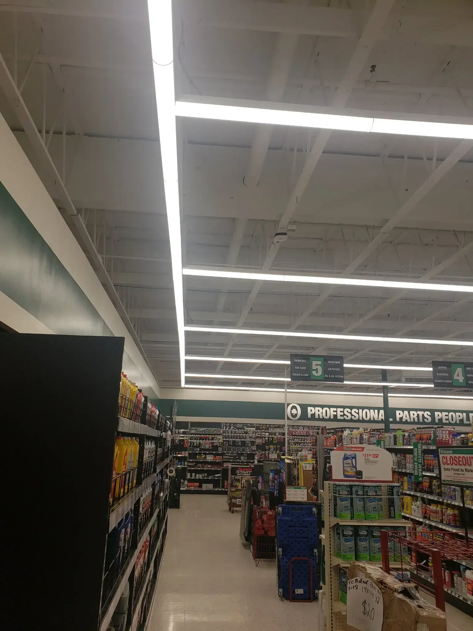 Commercial lighting installation by Krouse’s Electric in a Pierce County auto parts store, providing efficient and bright business lighting.