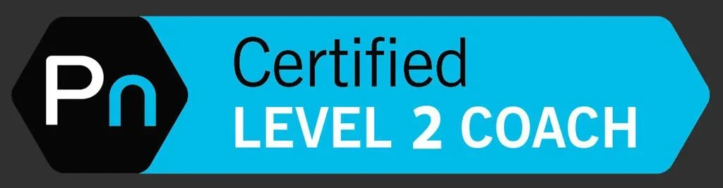 Badge with black and blue background reading 'Certified Level 2 Coach' with 'Pn' logo.