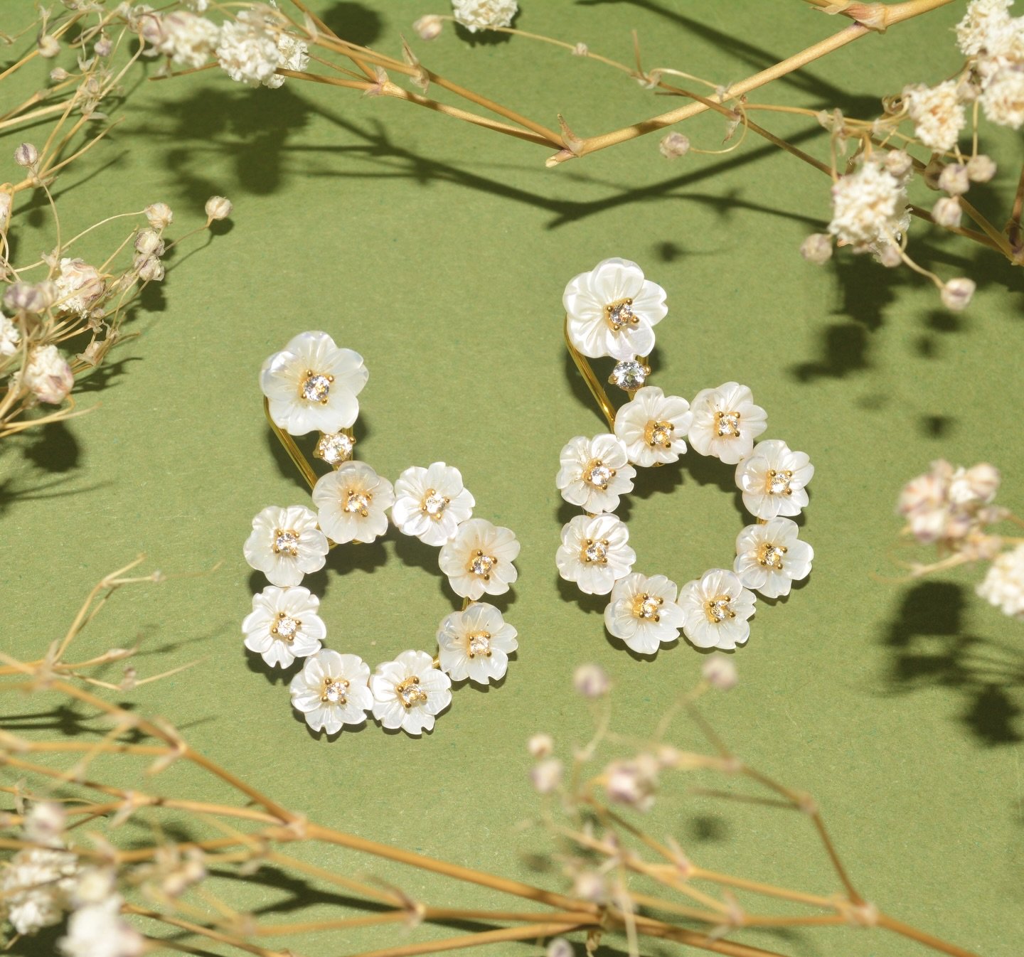 Bloom evokes the beauty of flowers in full bloom, highlighted by the soft radiance of topaz and delicate mother of pearl!

#CarolinaWong #handmadejewellery #sustainable #winterstyle #London #sustainablejewellery #winterfashion #cozyseason #winterootd