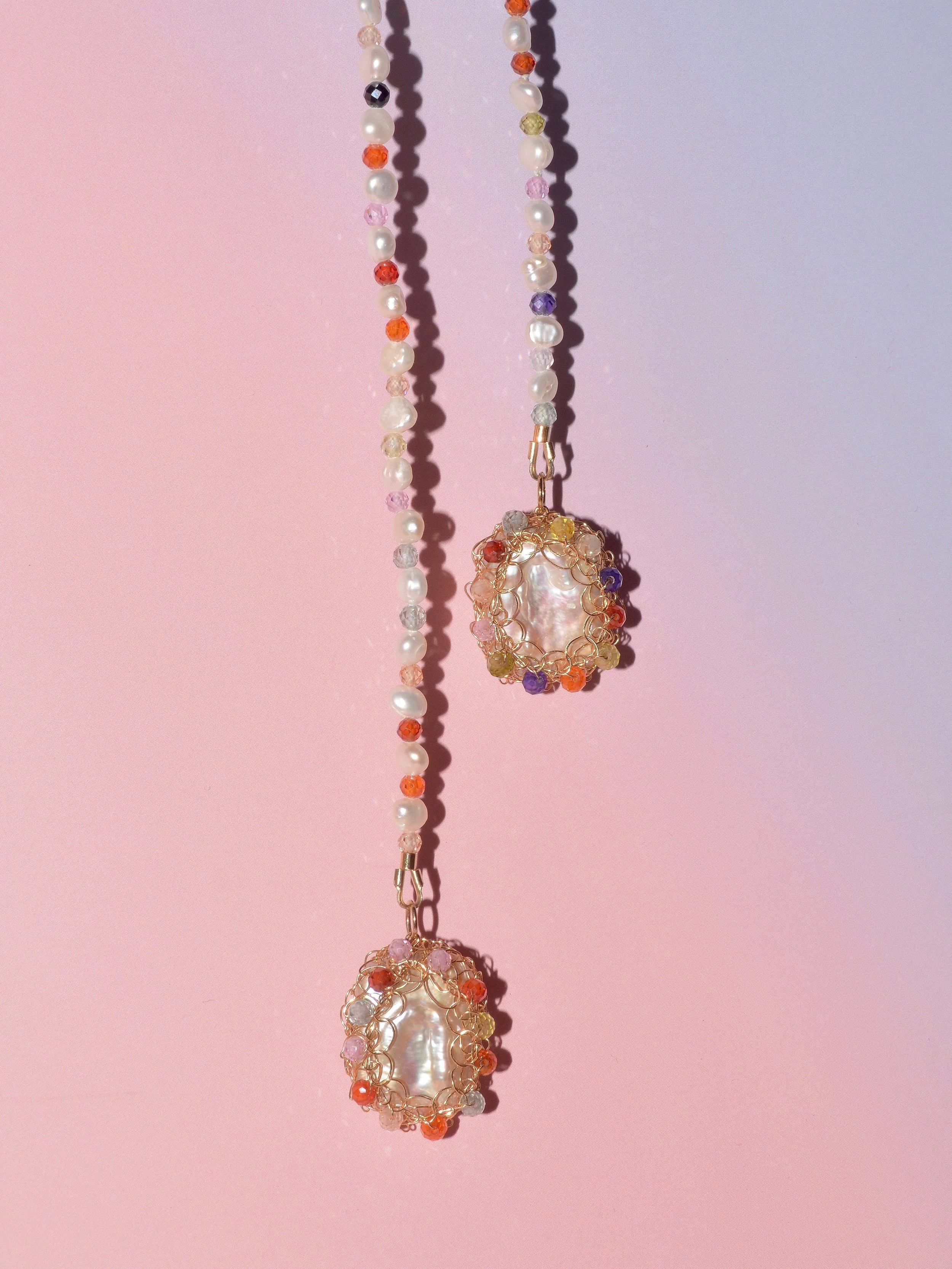 Cubic zirconia and white freshwater pearls - a match made in heaven, blending radiant sparkle with timeless elegance.