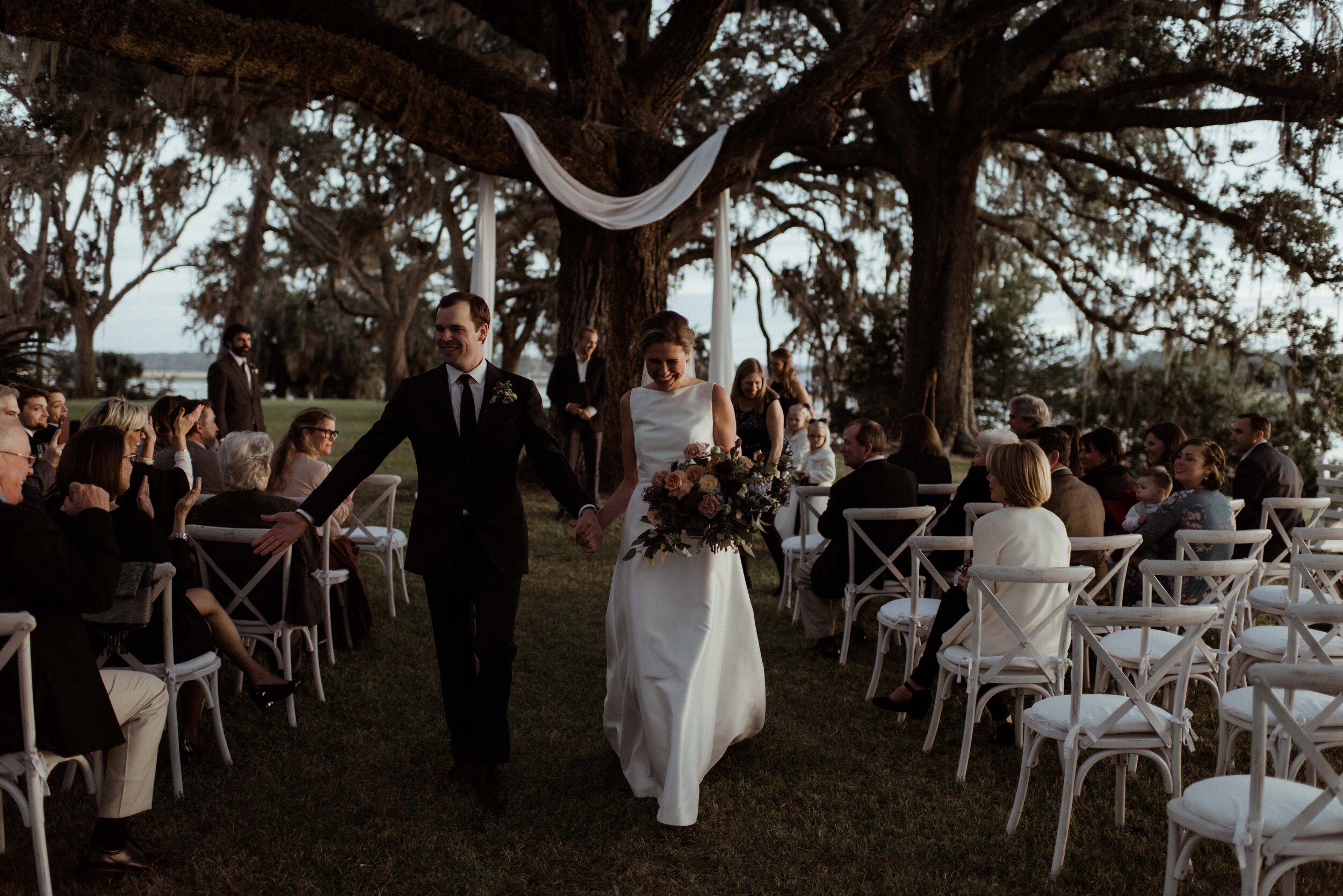 romantic-backyard-wedding-savannah-georgia-groom-highfives-family.jpg