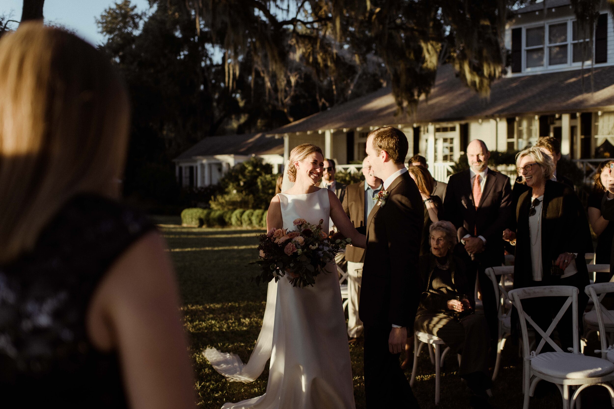 romantic-backyard-wedding-savannah-georgia-groom-meets-bride-on-aisle.jpg