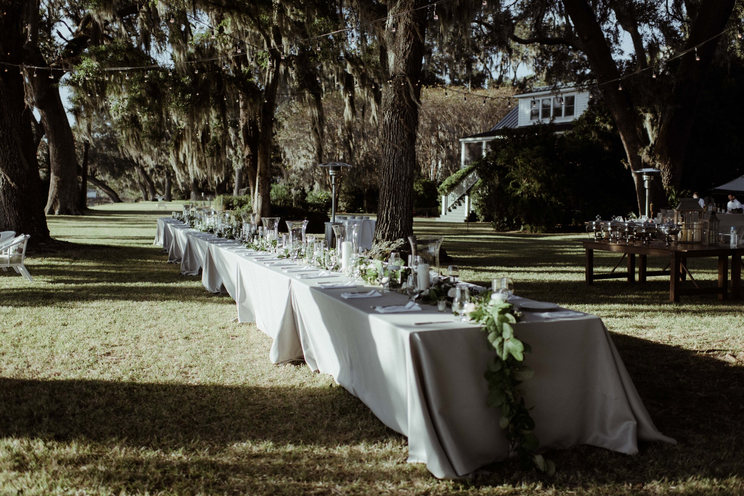 romantic-backyard-wedding-savannah-georgia-long-table-in-trees.jpg