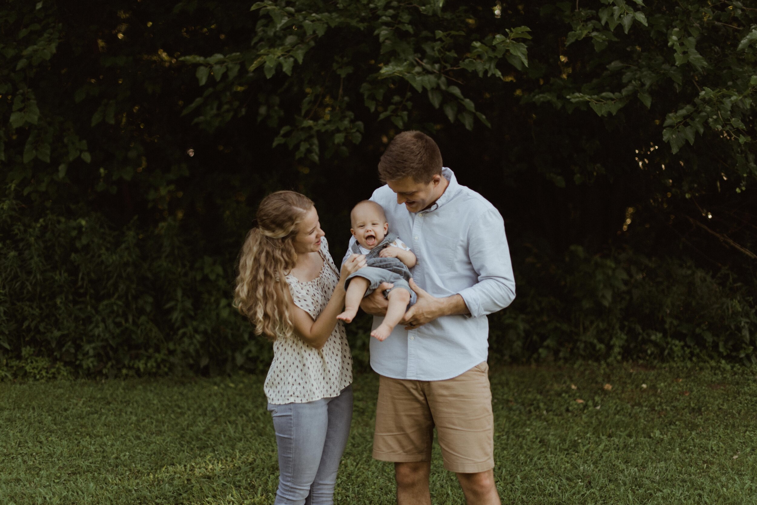 mom-tickles-baby-during-family-portraits-Waynesville-Missouri.jpg