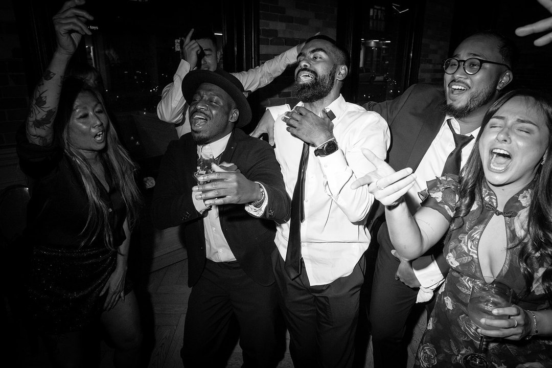 When the dance floor is packed all night, you know the reception was a huge success! This image captures the happy, high-energy atmosphere - pure, unfiltered fun with a crowd celebrating B+Q. Just non-stop dancing, singing their hearts out and happy 