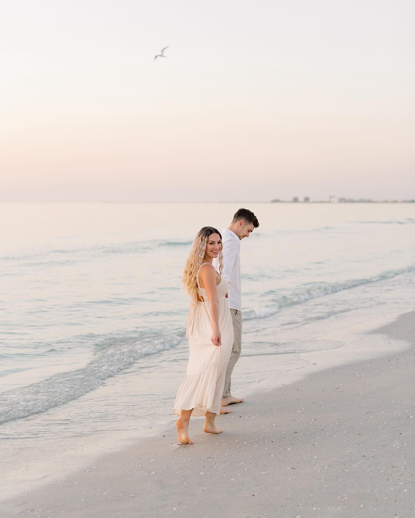 Take me back to pastel skies and sunsets strolls. 🐚Also more engagement sessions where frolicking in the sand and water are a requirement.