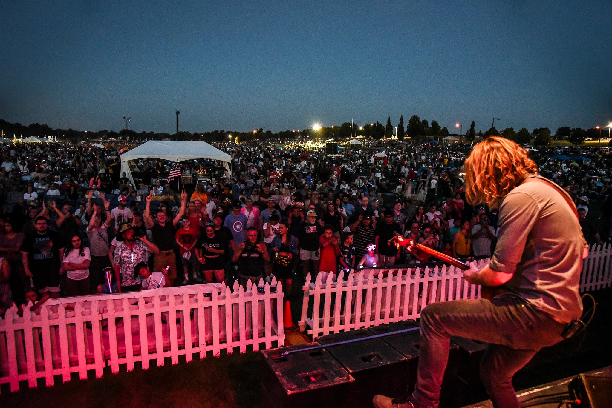 Scott Uhl performing live on electric guitar with touring band on Festival stage