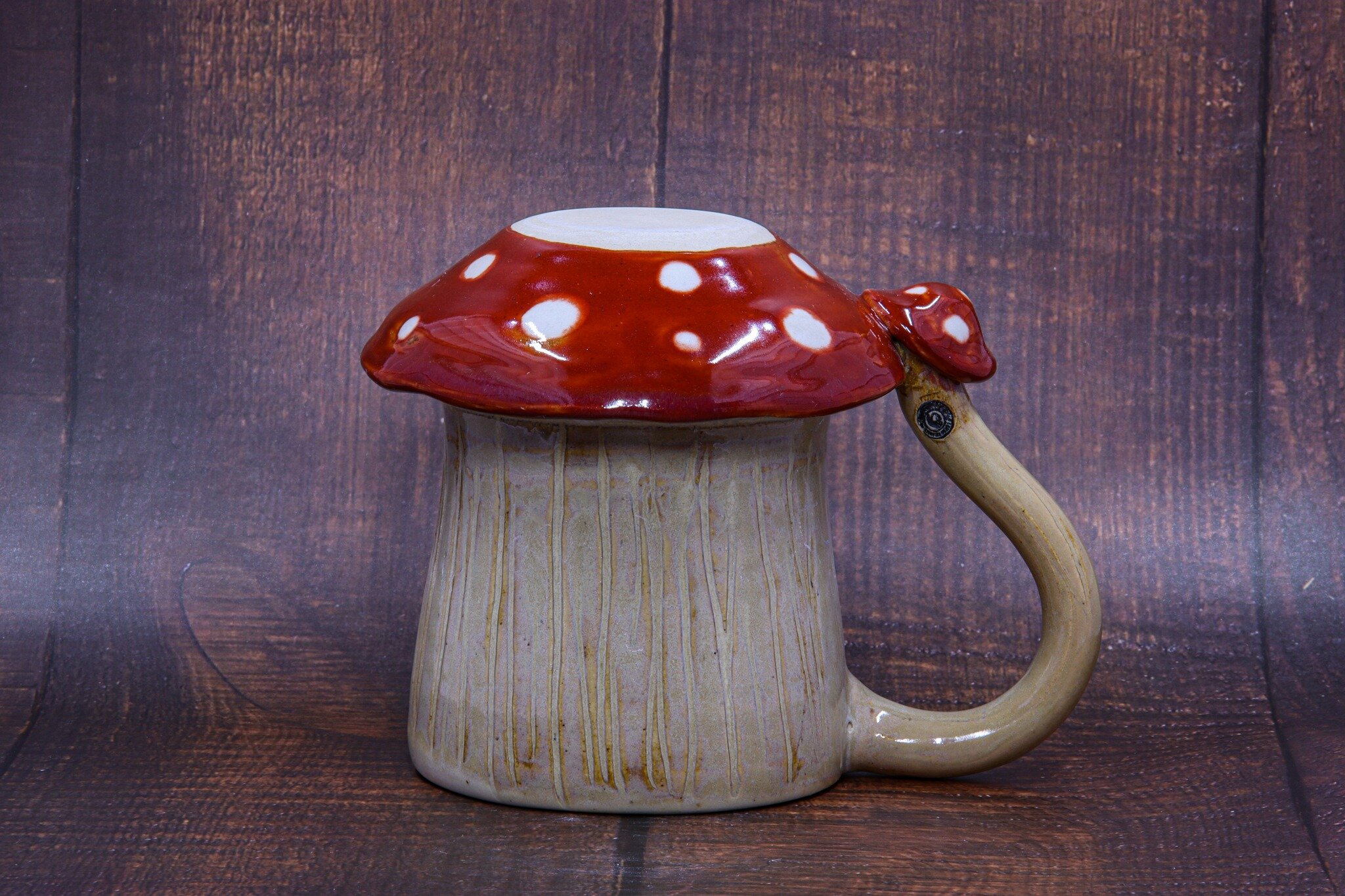 This is one of several mushroom mugs made for a custom order!

I love coming up with new and interesting ideas to make something special and one-of-a-kind! Mug one way and mushroom d&eacute;cor when it's upside-down!

Let me know if you want to see t