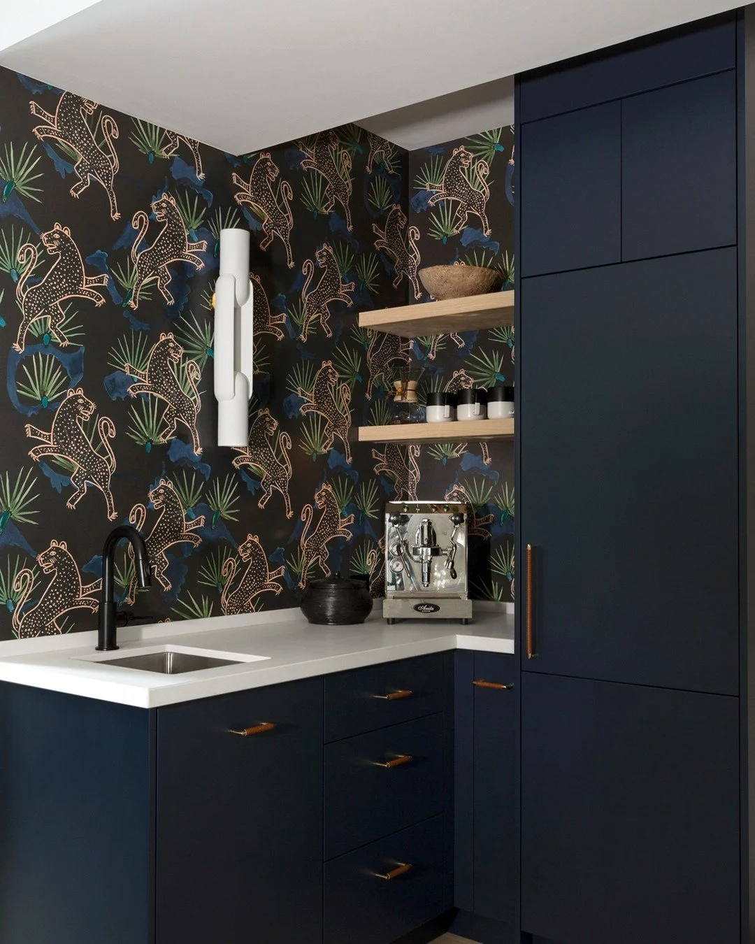 We&rsquo;ve shared this corner from our Gloucester project before, but never the part that really makes it &mdash; the lighting.

The wallpaper brings all the energy, so we needed something that could keep up without overpowering it.
This sculptural 