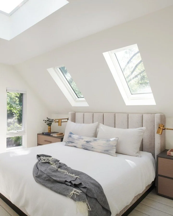 Turning an unused attic into a full principal suite is no small feat, but this one became a favourite. 

We preserved the craftsman character outside while completely reworking the inside: skylights over the bed, clerestory windows lining the stairca