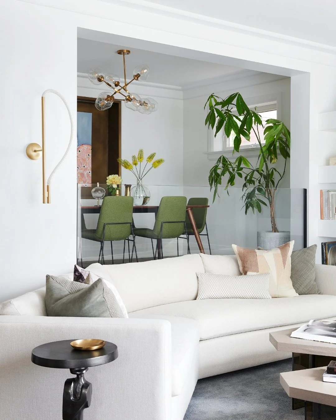 Jenn and Brad told me they wanted to feel proud of their home. They wanted it to reflect their style and feel more sophisticated, but still like them.

The living room was open to the entry, and they were stuck on how to best lay out the furniture gi