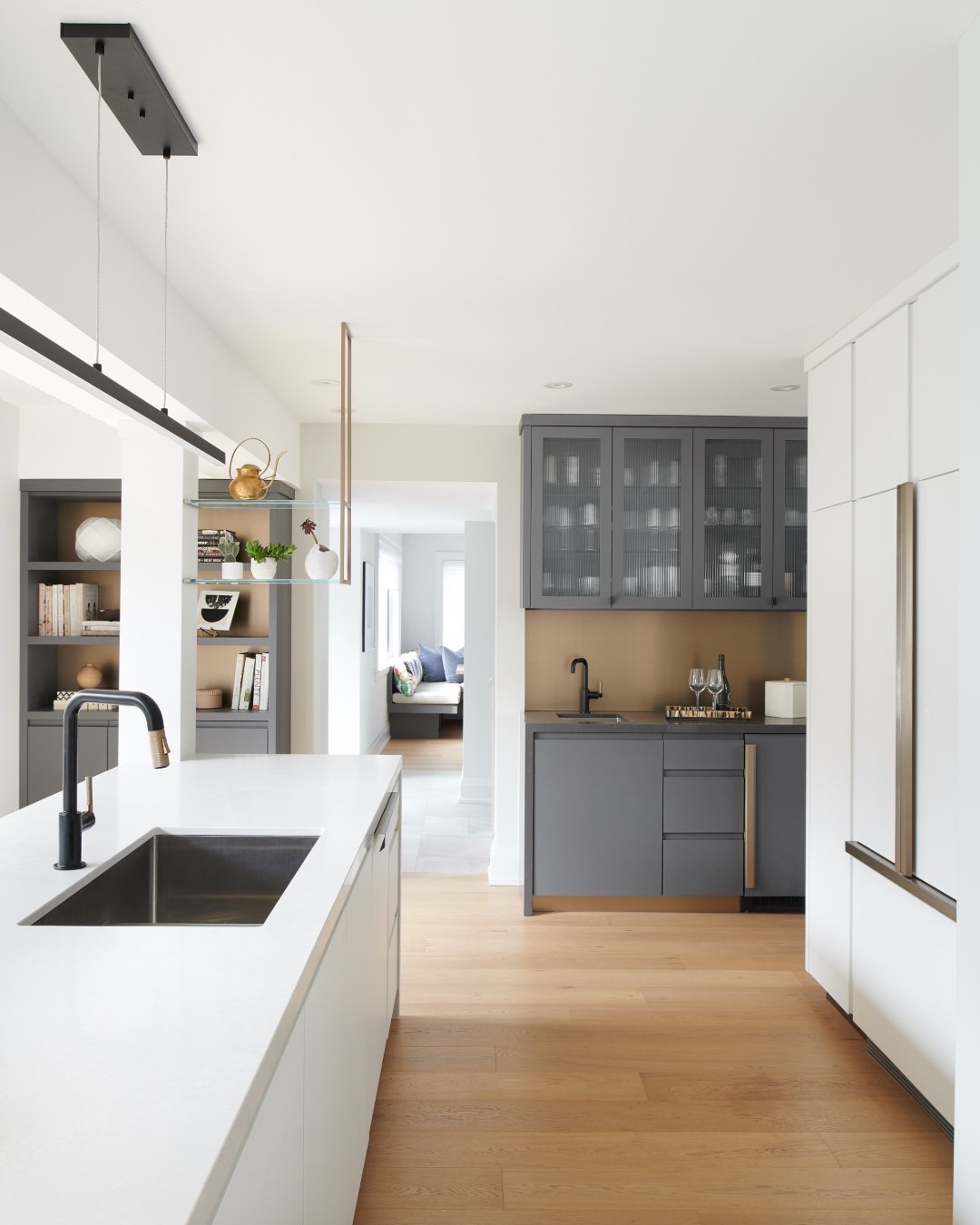 This family loves to entertain, so the kitchen really needed to perform.

They told me guests tend to gather in the kitchen while prep is happening, so we wanted the island to be substantial. We extended it so there&rsquo;s space for everyone to spre