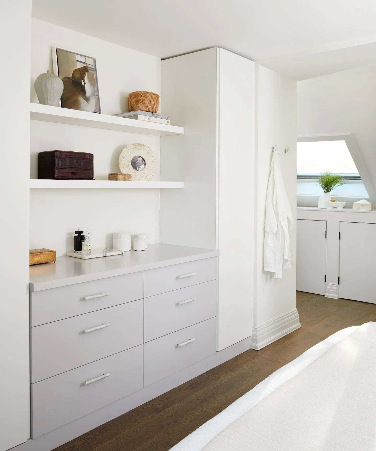 A lot of bedrooms end up becoming storage rooms without anyone meaning for it to happen.

Extra blankets here. A chair that slowly collects clothes. Furniture that technically works but doesn&rsquo;t quite fit the space.

That was the situation here.