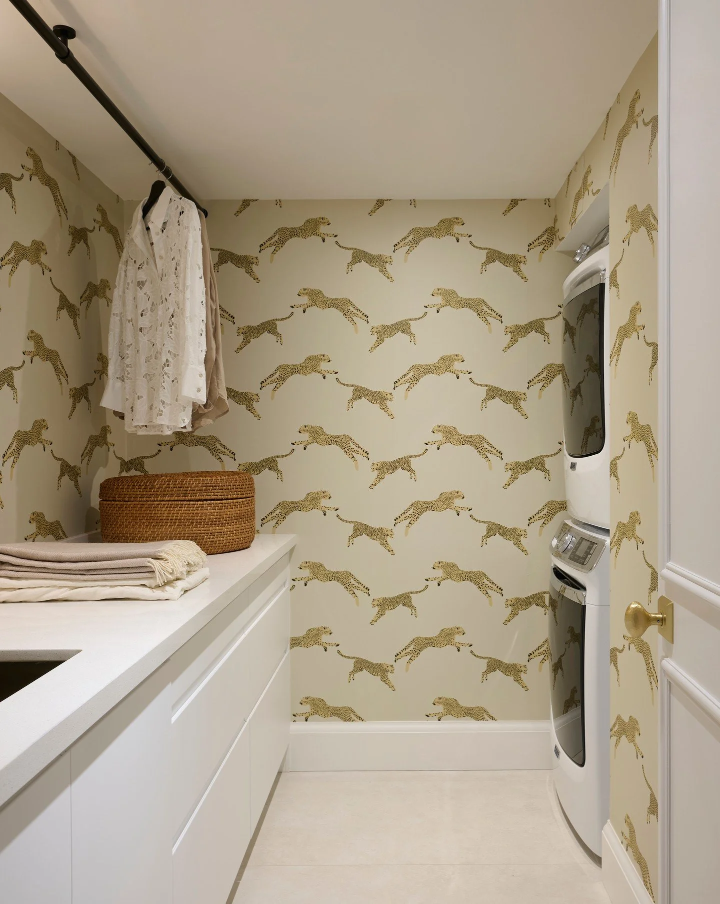 I think even the most practical spaces deserve a bit of personality.

We wanted the laundry room to feel fresh, organized, and efficient, so we brought in this cheetah wallpaper to lift the mood.

Laundry&rsquo;s never going to be the highlight of yo