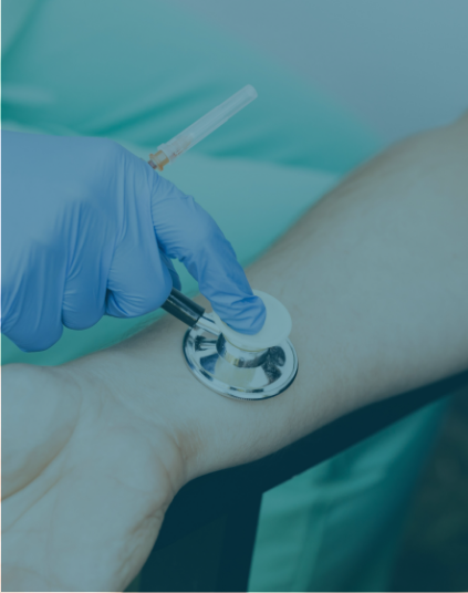 A blue tinted photo of a doctor using a stethoscope on a patient.