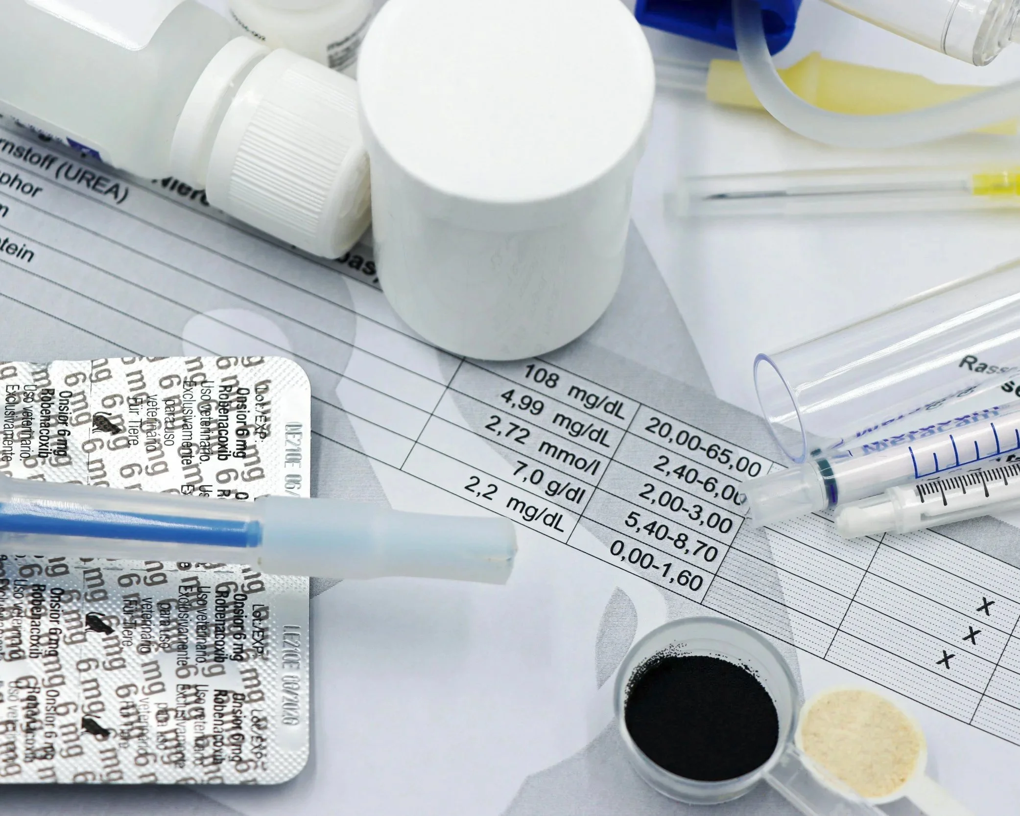 A layout scene with diagnostic testing equipment, a pen, test results, and gauze.