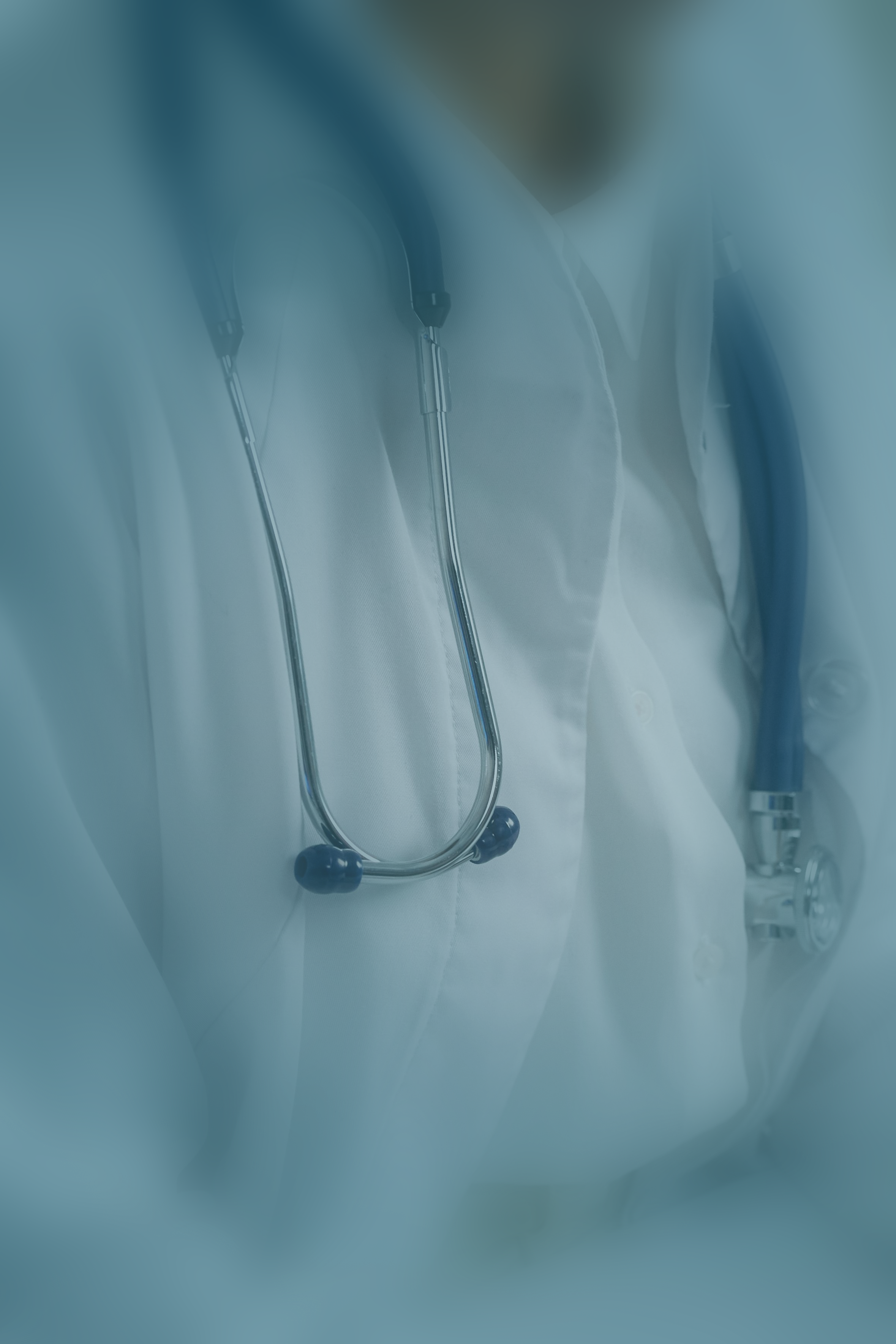 A blue tinted photo of a doctor's lab coat and stethoscope.
