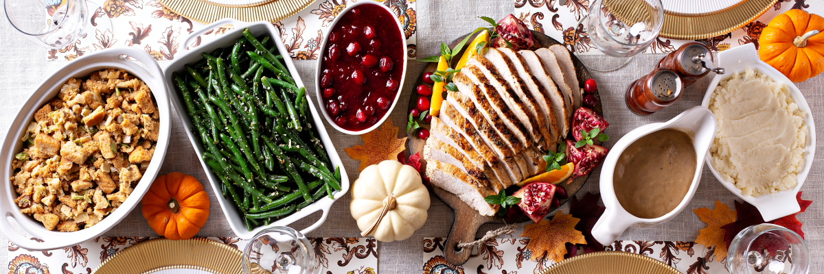 Thanksgiving dinner table, overhead shot, long banner