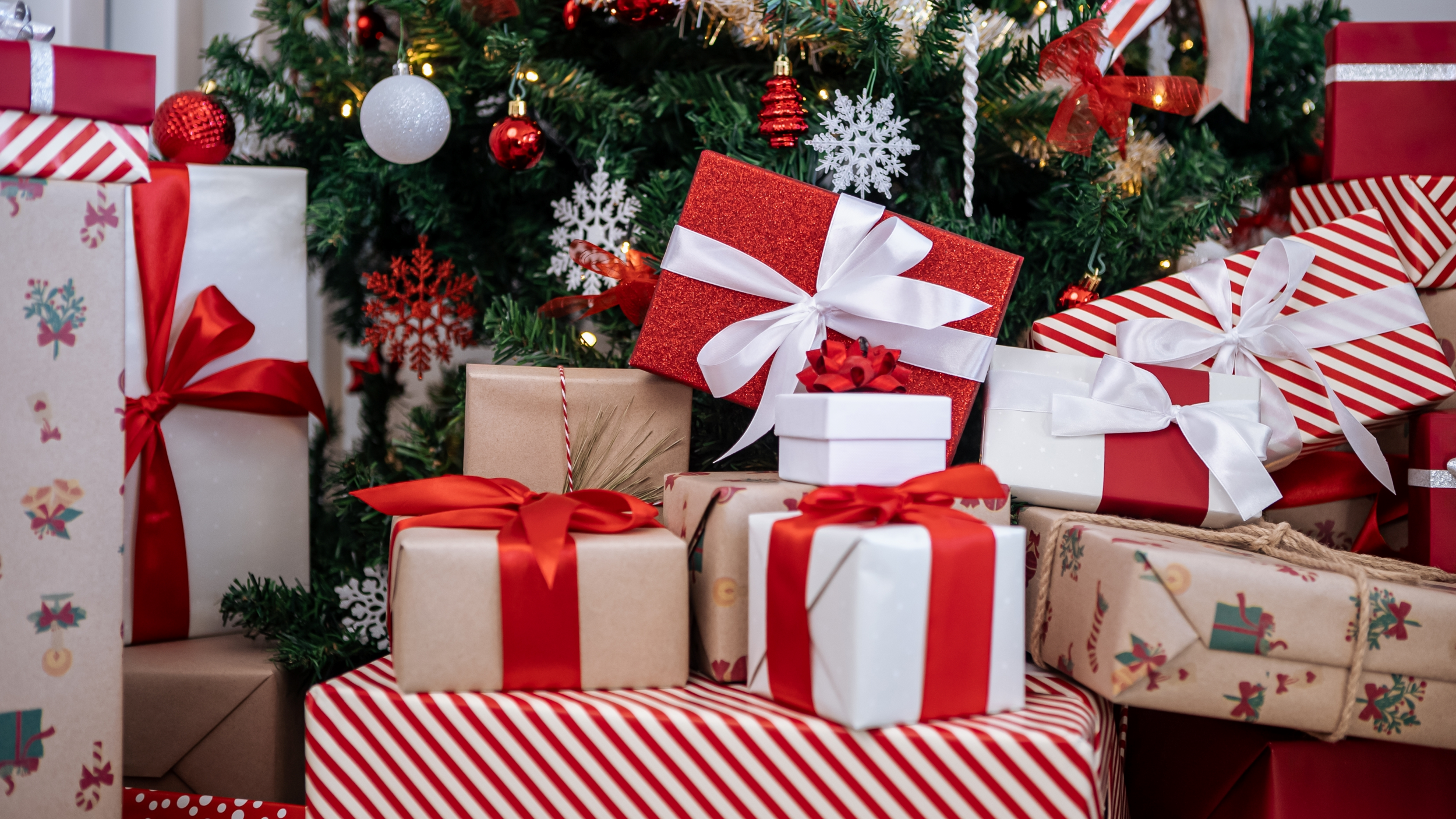 Pile of Gifts Under Christmas Tree 2500x1406.png