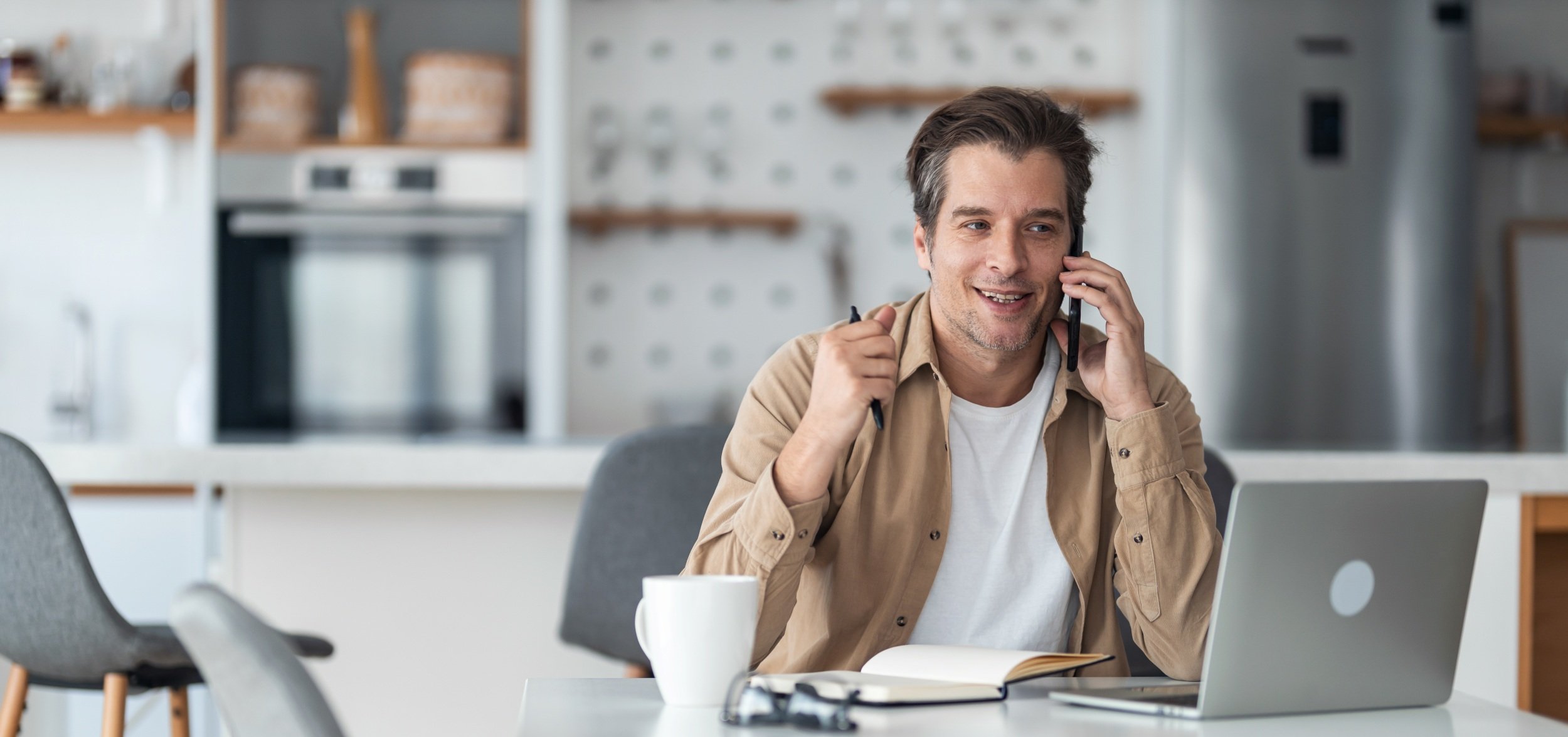 Man On Phone With Financial Coach 2500x1667.jpg