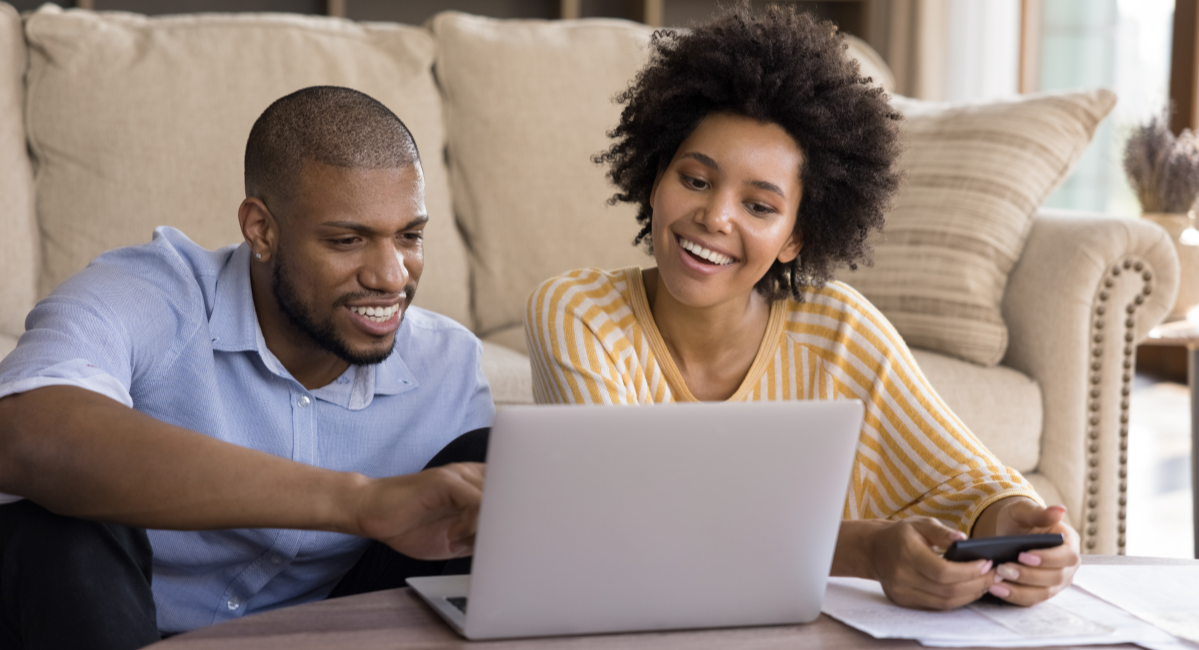 Young AA Couple with Laptop and Paperwork 1200x800.png