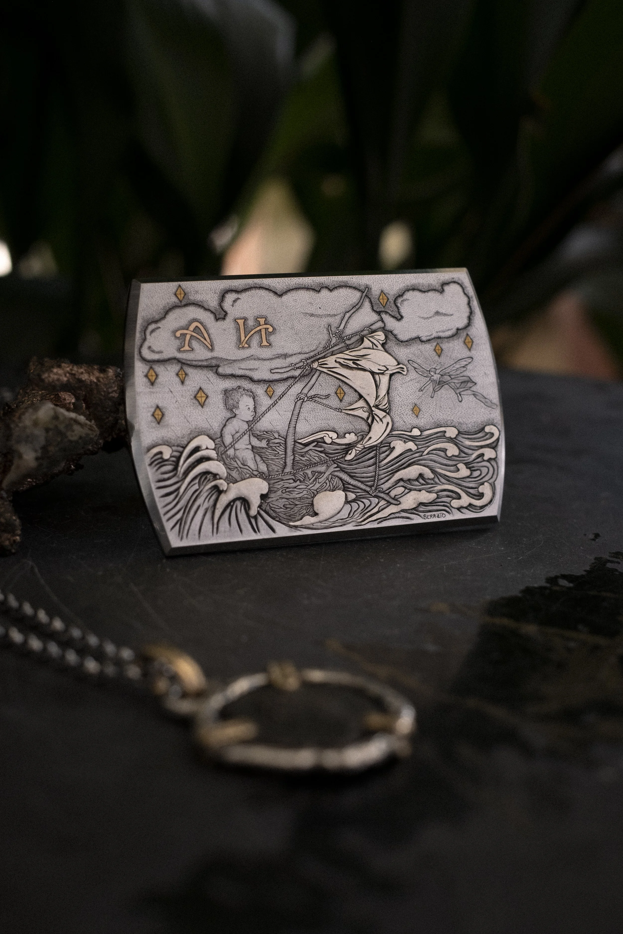A hand engraved and inlaid belt buckle made in collaboration with Torino-based Knife & Belt Buckle maker, Paolo Molari. This piece exhibits the use of mixed techniques including surface engraving, sculpting, punto bulino, and pure silver and 24k gold