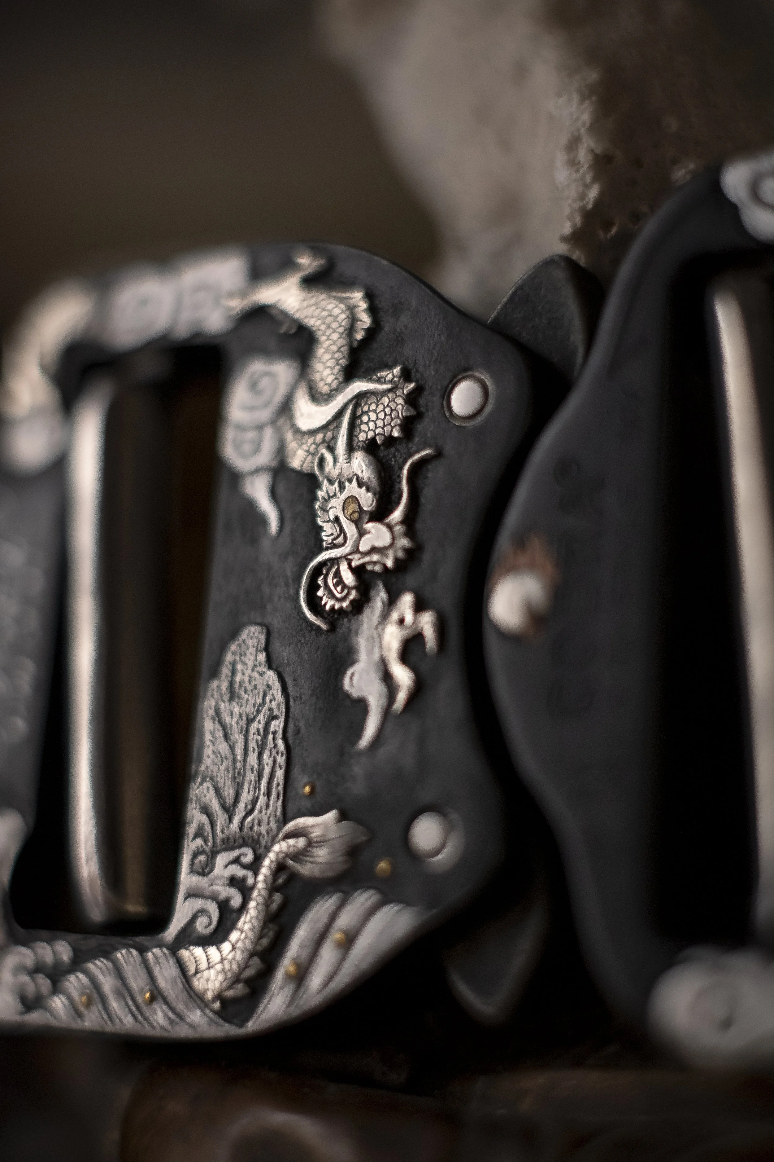 A hand engraved and inlaid belt buckle made in collaboration with The Observer Collection. This piece was inspired by "tsuba," the handguard of Samurai swords, and exhibits the use of mixed techniques including surface engraving, sculpting, punto bul