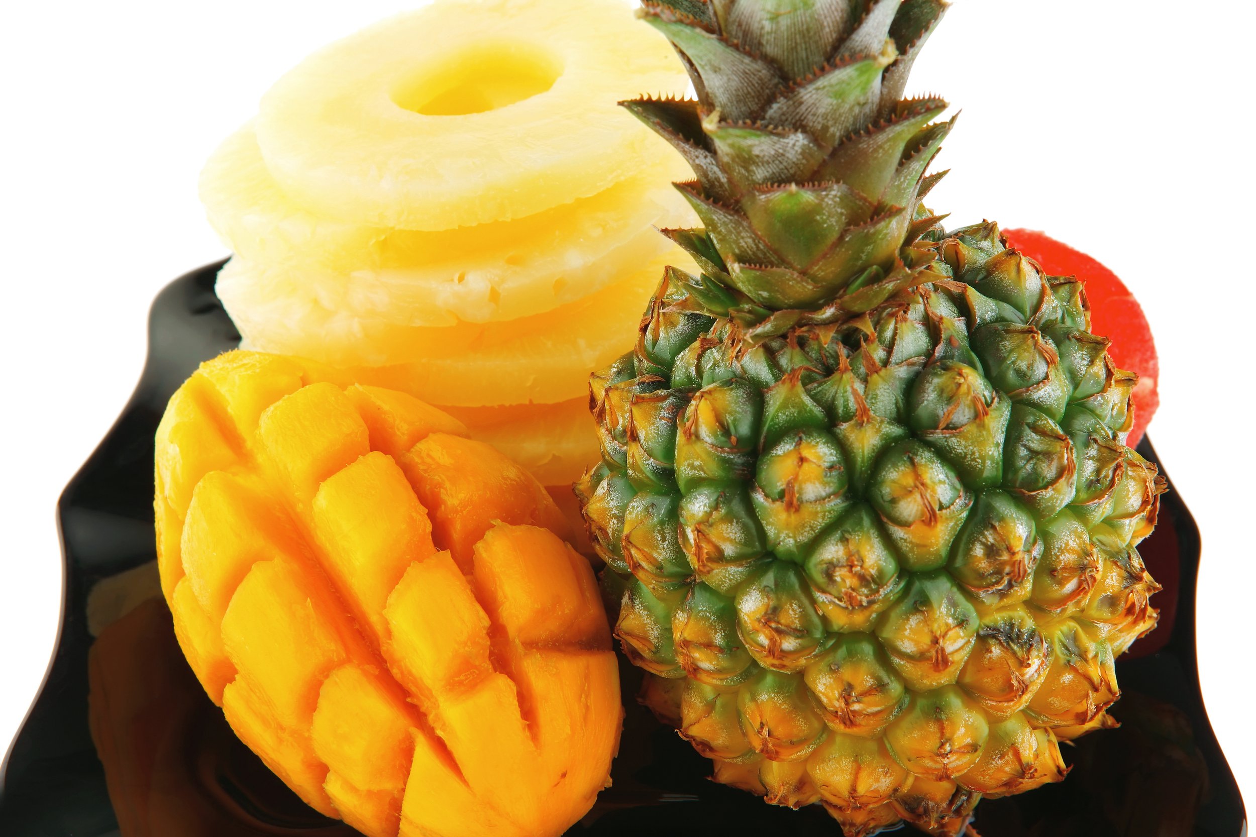 bigstock-raw-pineapple-on-black-plate-i-120853295 (2).jpg