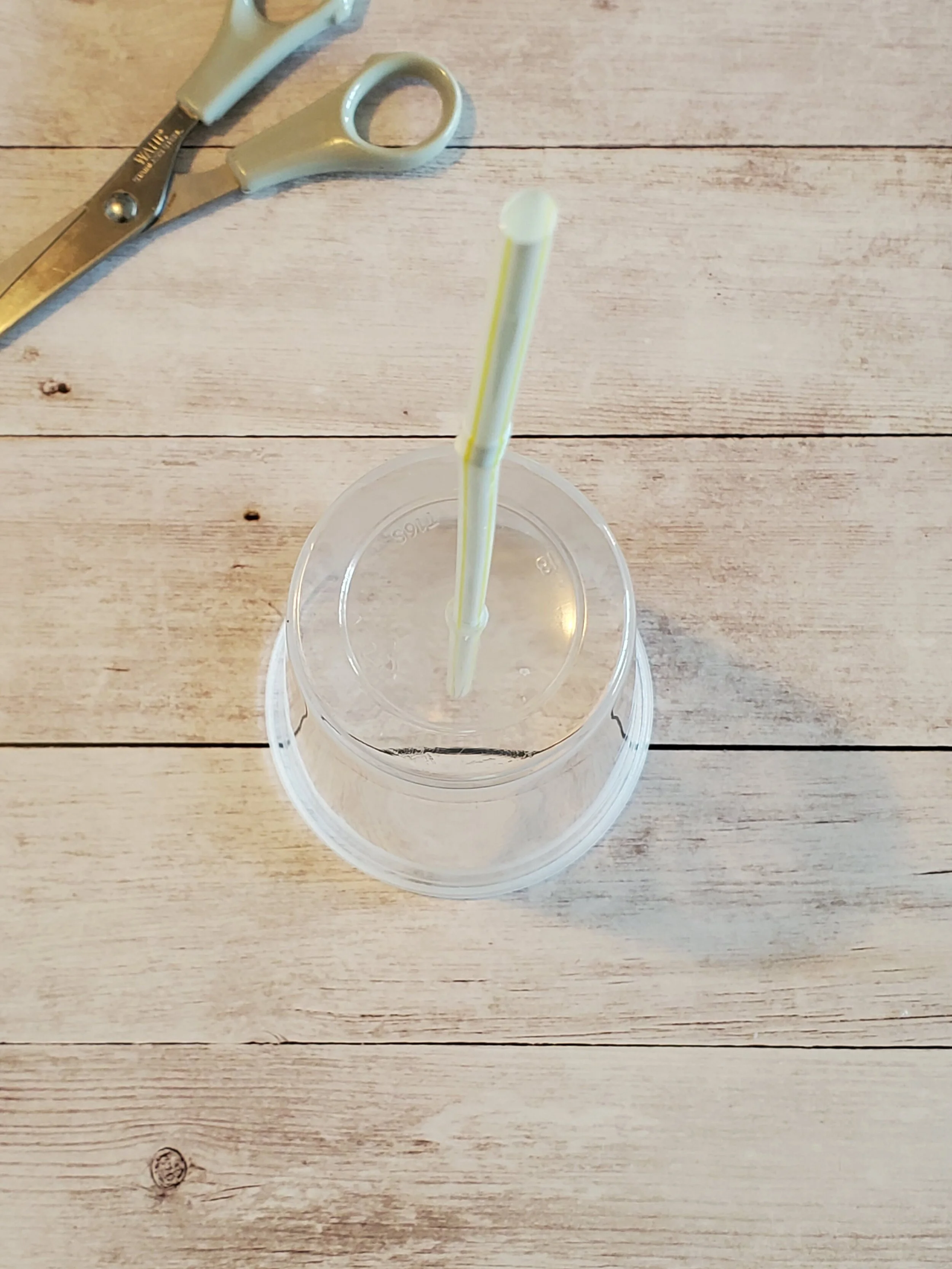 The straw should fit snugly into the hole to prevent air from leaking out and to allow the straw to sit tightly without moving on it’s own.